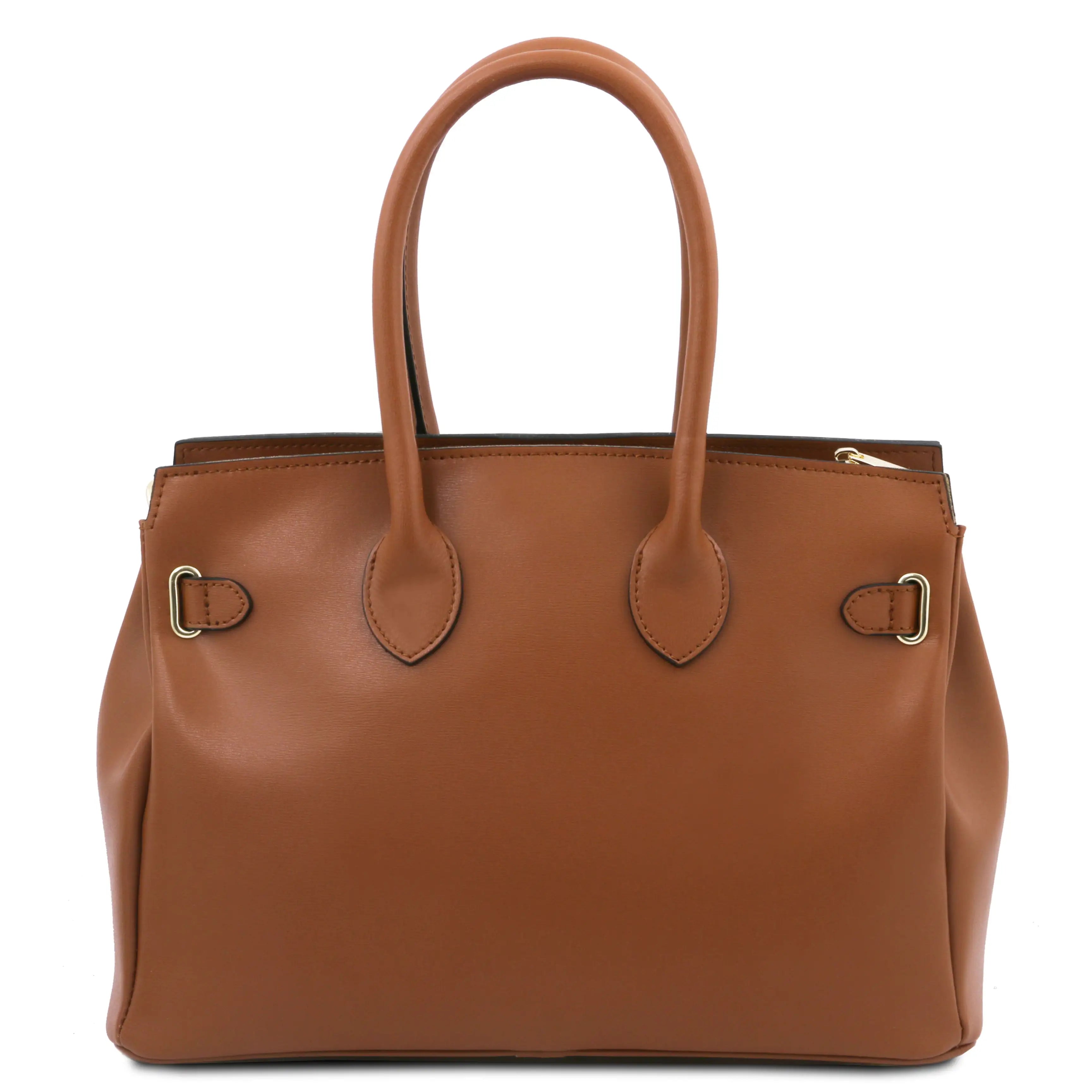 Brown leather handbag with gold hardware on a white background