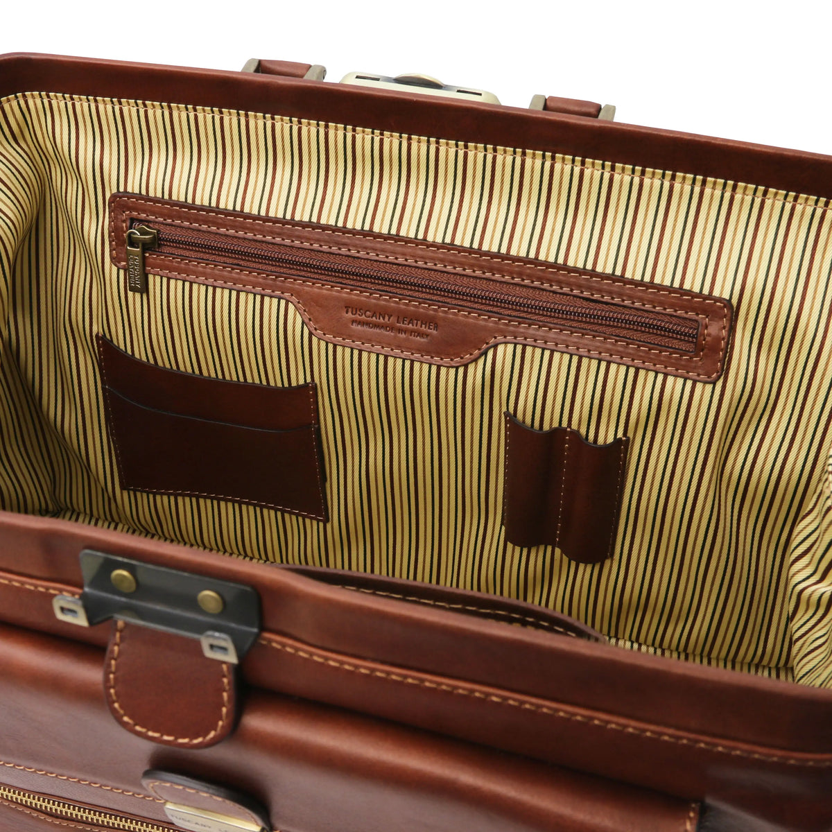 Close-up of a brown leather doctor bag with zipped pocket, card and pen slots and striped interior.
