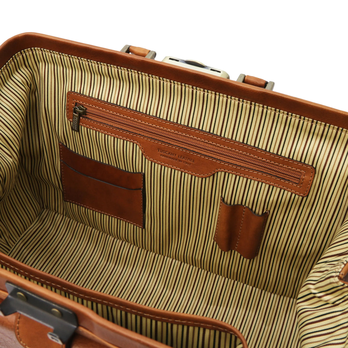 Close-up of a natural leather doctor bag with zipped pocket, card and pen slots and striped interior.