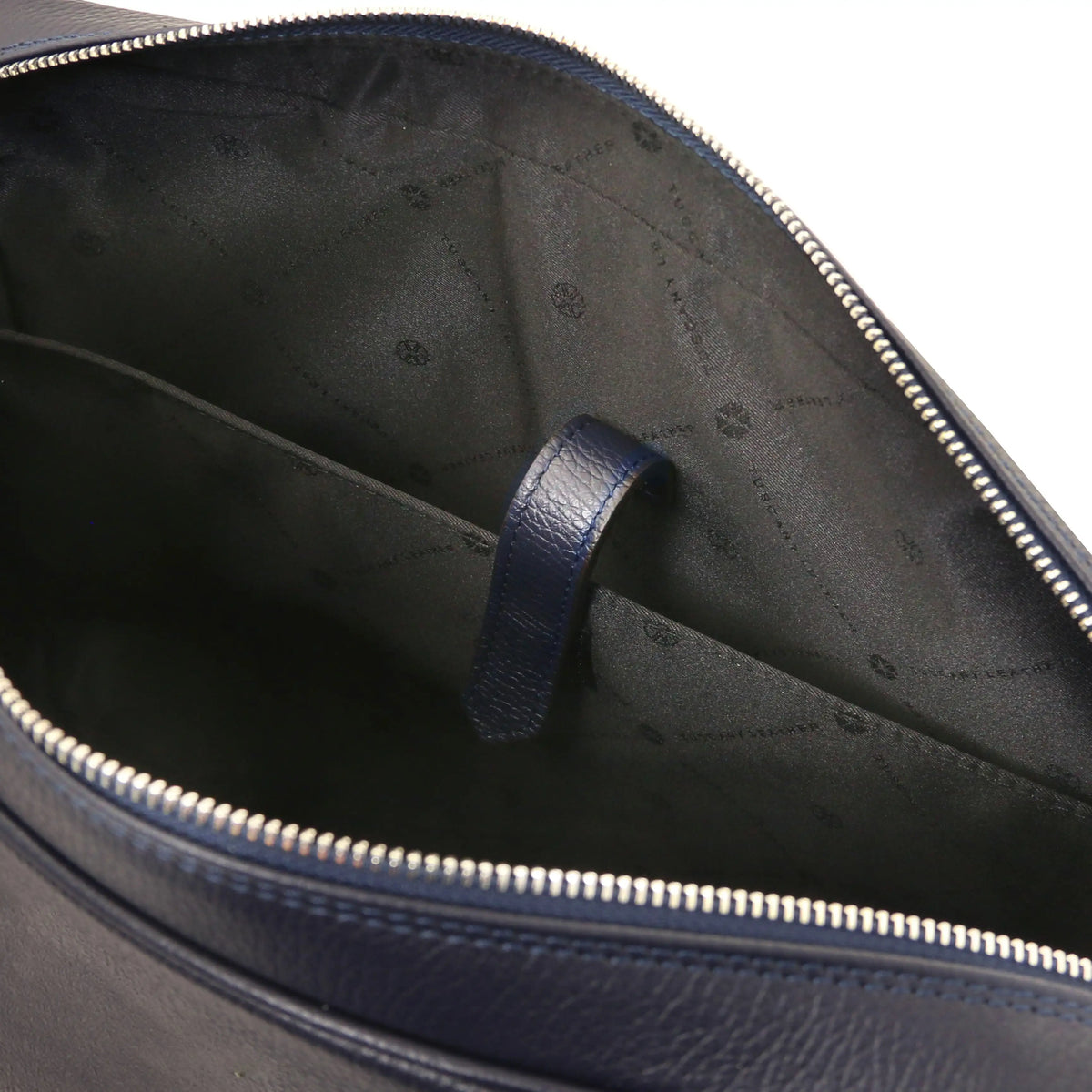 Close-up of a blue leather bag with a zipper, showing the black interior and laptop compartment