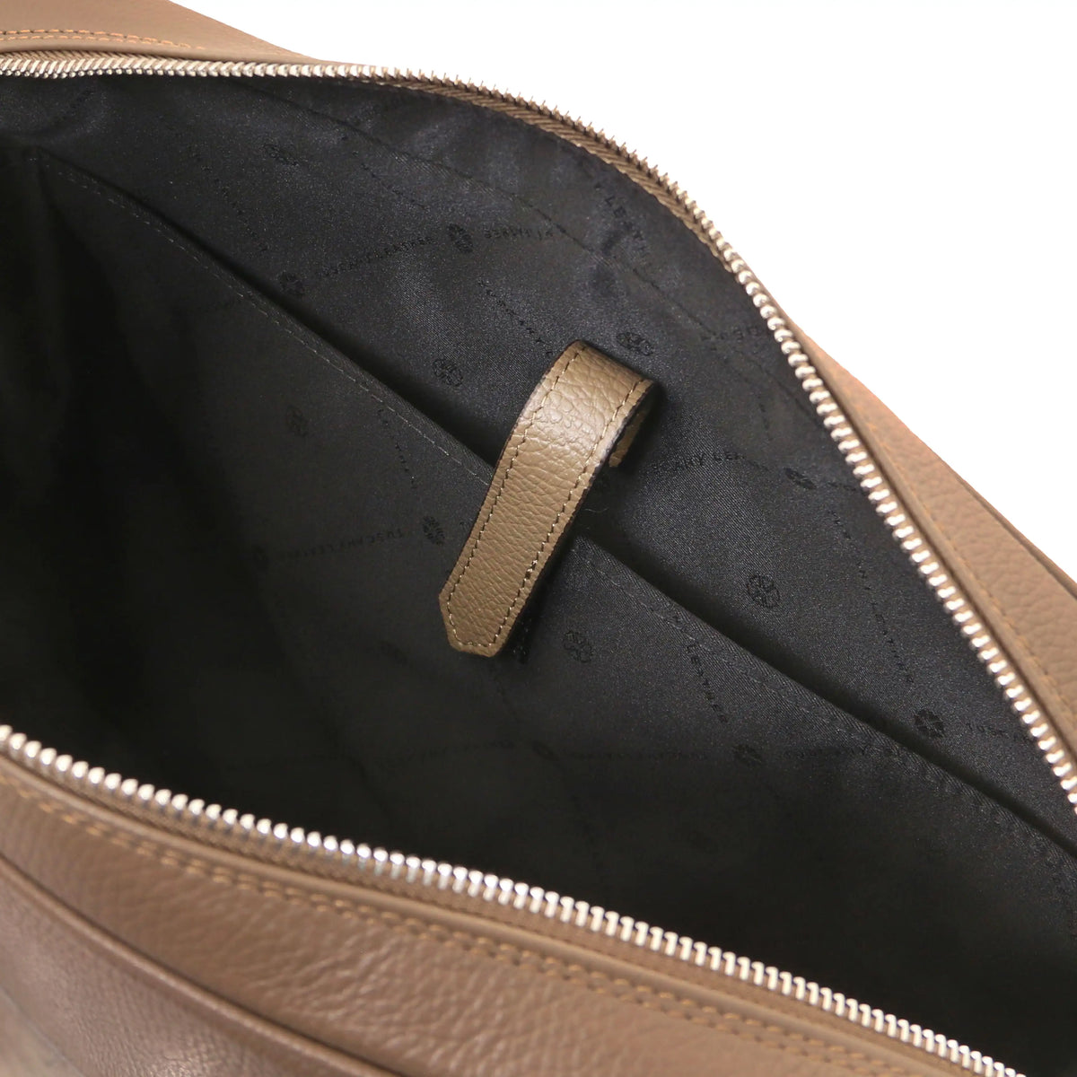 Close-up of a taupe leather bag with a zipper, showing the black interior and laptop compartment