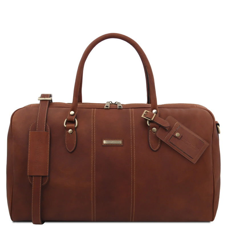 Brown leather duffel bag with gold hardware on a white background