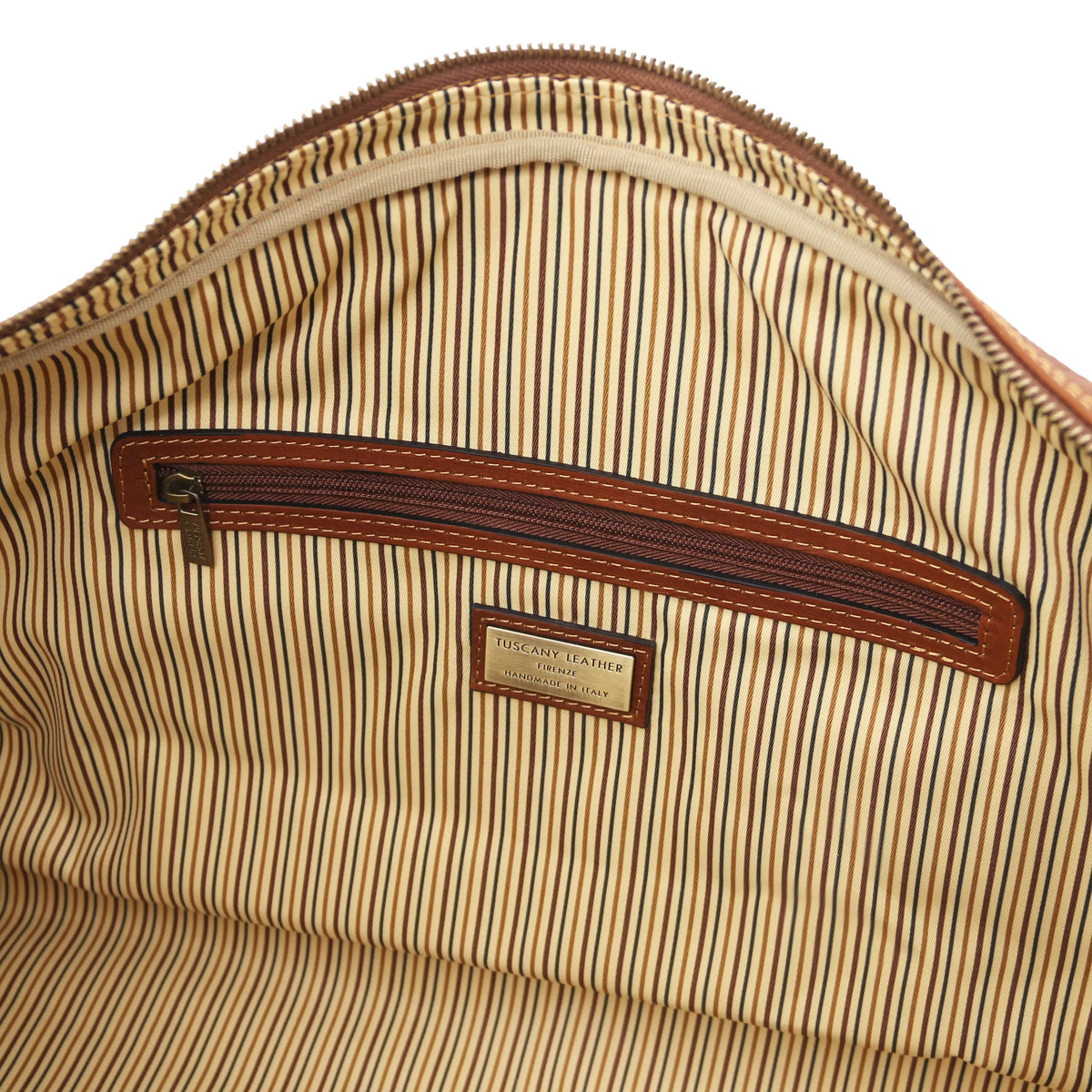 Close-up of a striped fabric cotton interior with a brown zipper and visible brand logo.