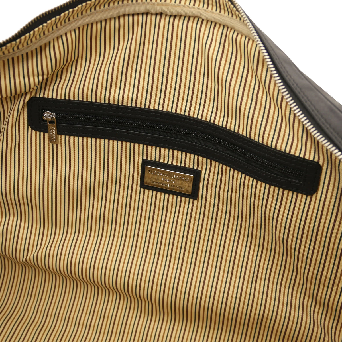 Close-up of a striped cotton interior with a brand label on a white background