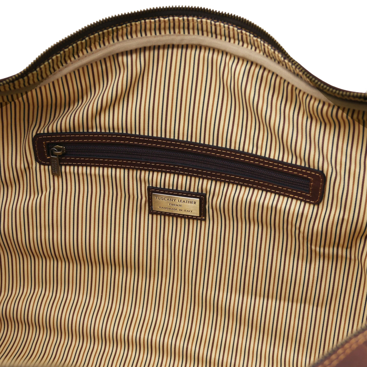 Close-up of a striped fabric with a visible brand label on a white background