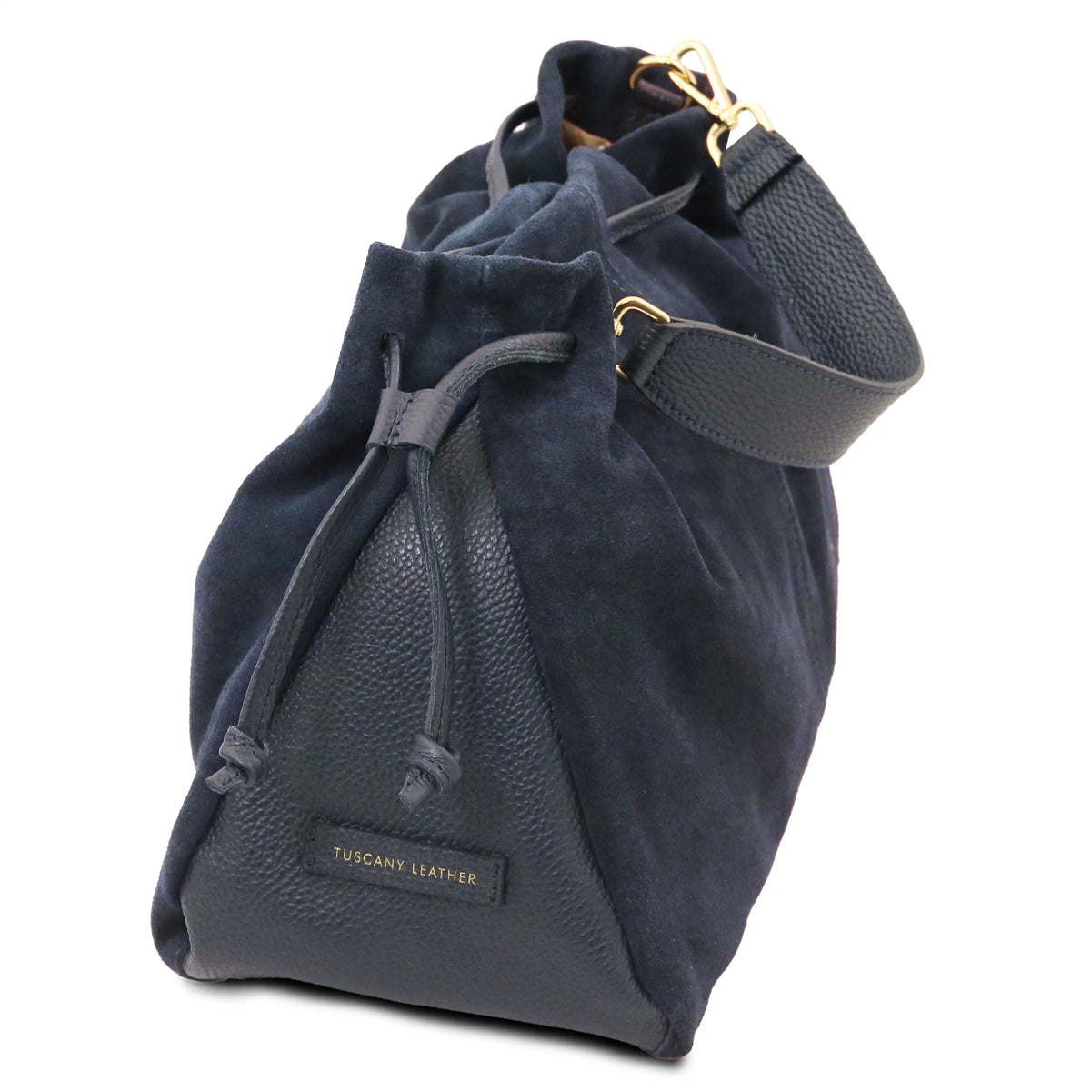 A dark blue drawstring shopper bag  featuring a suede-like upper section, a textured pebbled leather base, a matching leather shoulder strap, and gold-tone hardware.