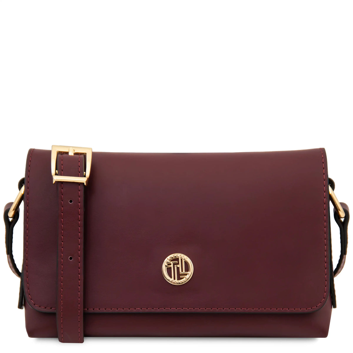 A burgundy leather crossbody bag with gold-tone hardware, featuring a front flap with a circular interlocking monogram logo and a  shoulder strap.