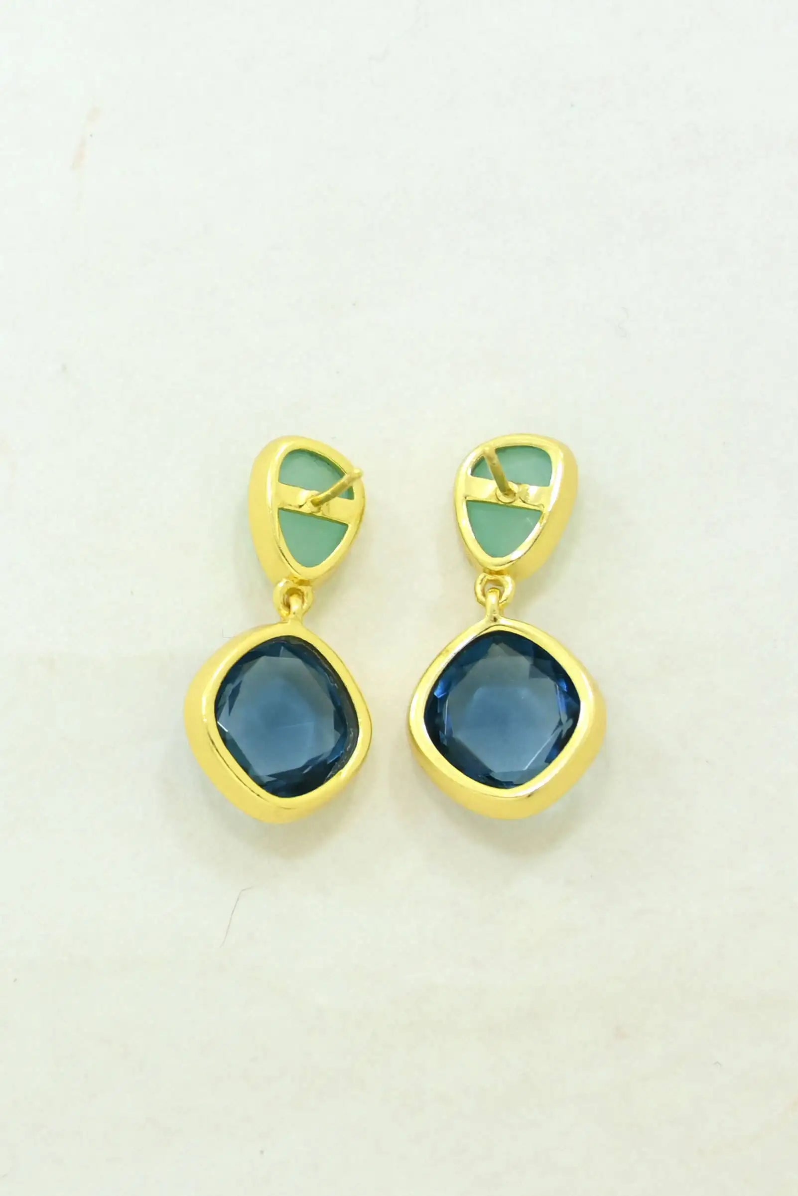 Back view Daleyza Drop Earrings with Blue Iolite & Aqua Chalcedony on a natural background.