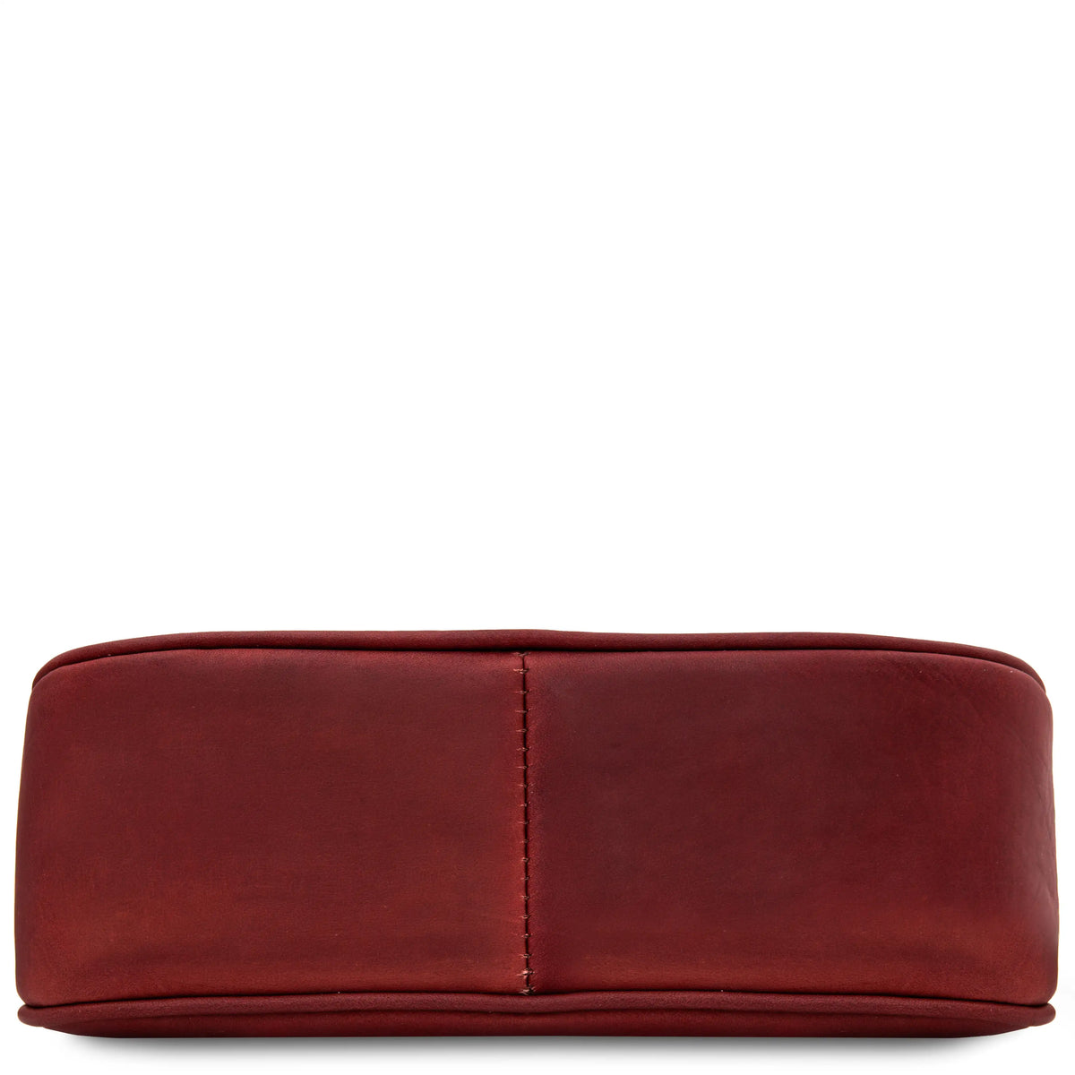 Bottom of a red leather handbag with a vertical stitched seam, shown against a plain white background.
