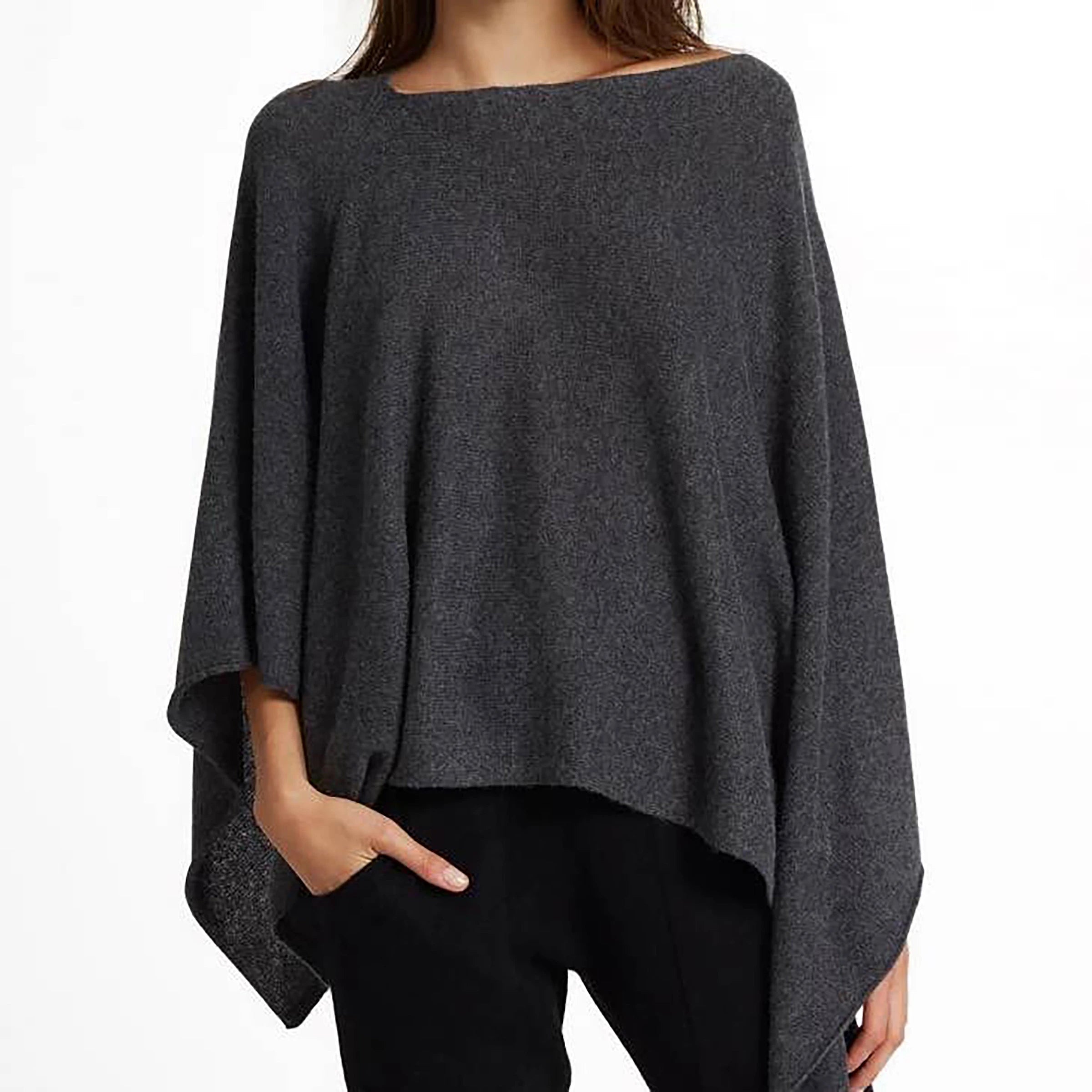 Charcoal Cashmere Asymmetrical Poncho on a woman wearing black pants standing on a white background