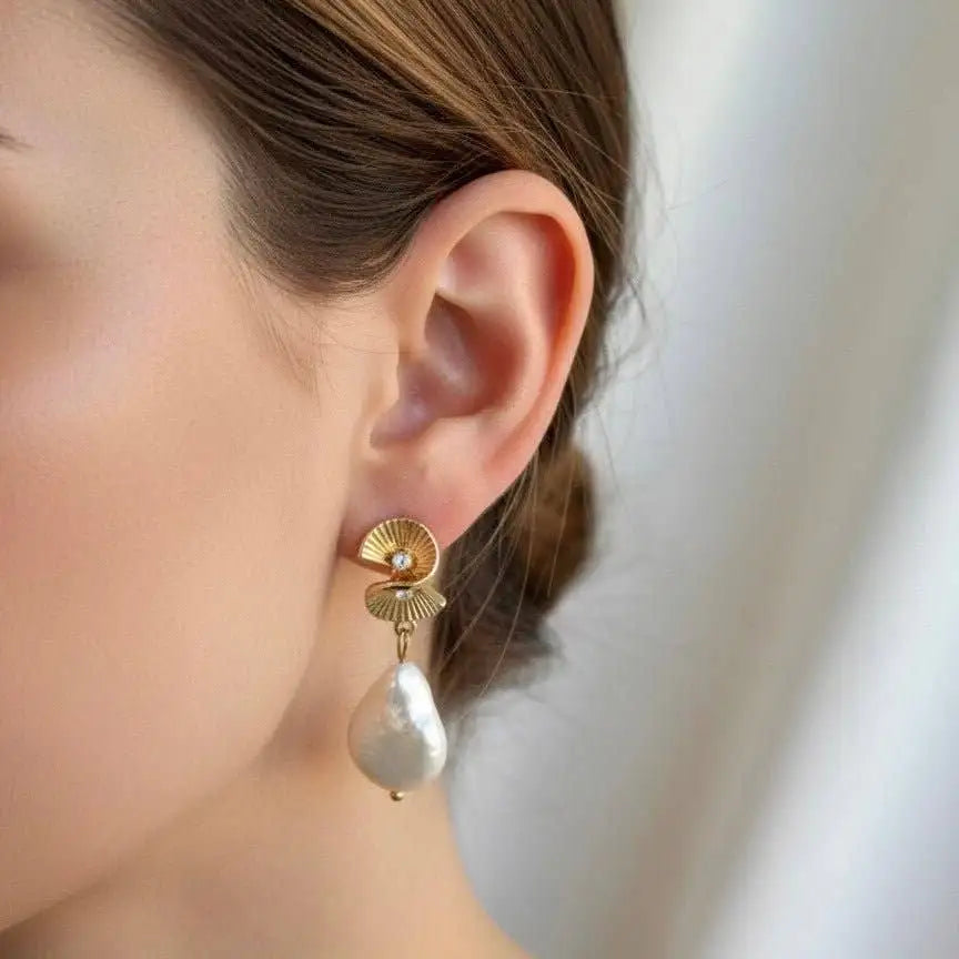 Close up view Amalfi Solia Stud Earrings on a woman's left ear.