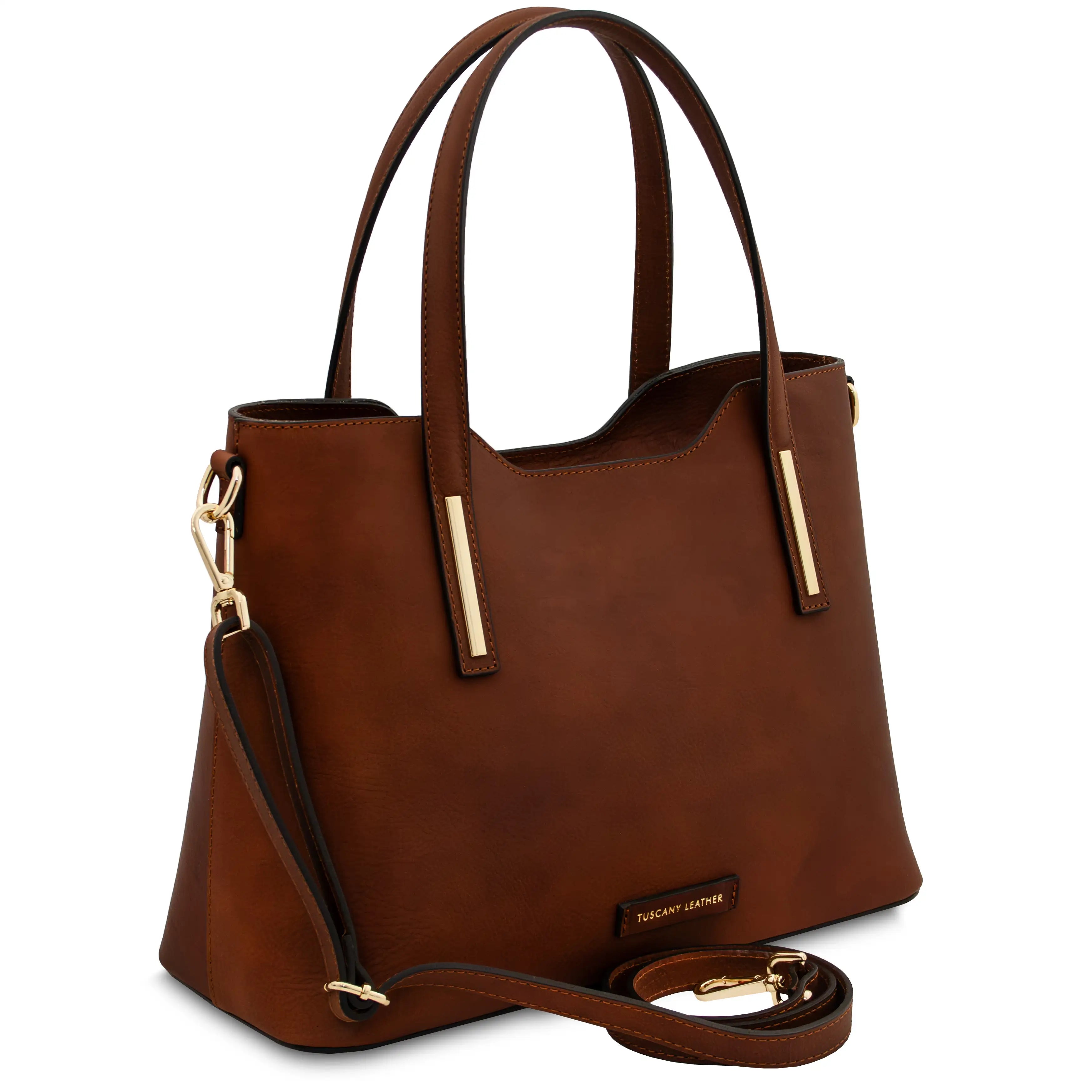 Front angled view Olimpia Leather Tote Bag in Brown with shoulder strap