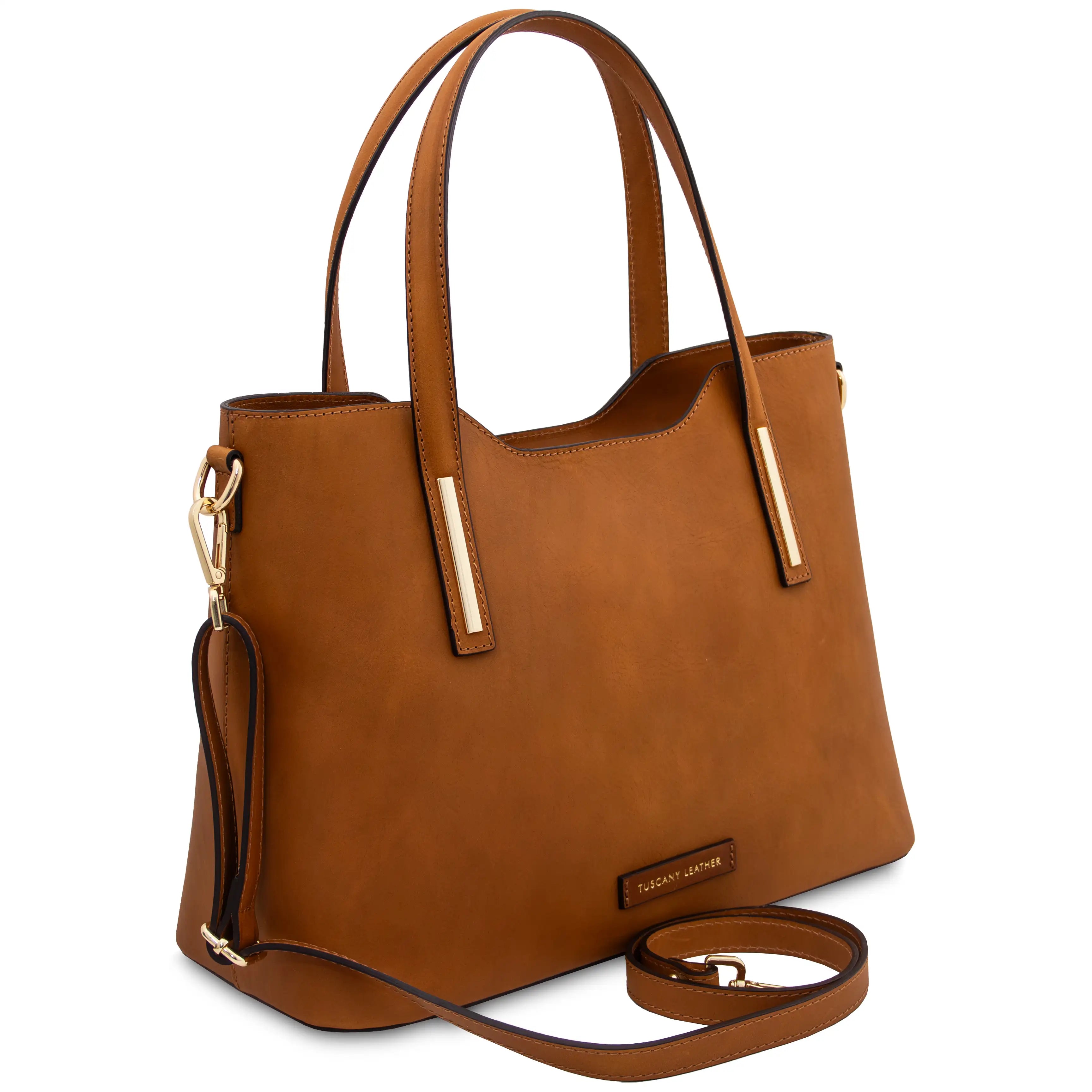 Front angled view Olimpia Leather Tote Bag in Natural with shoulder strap