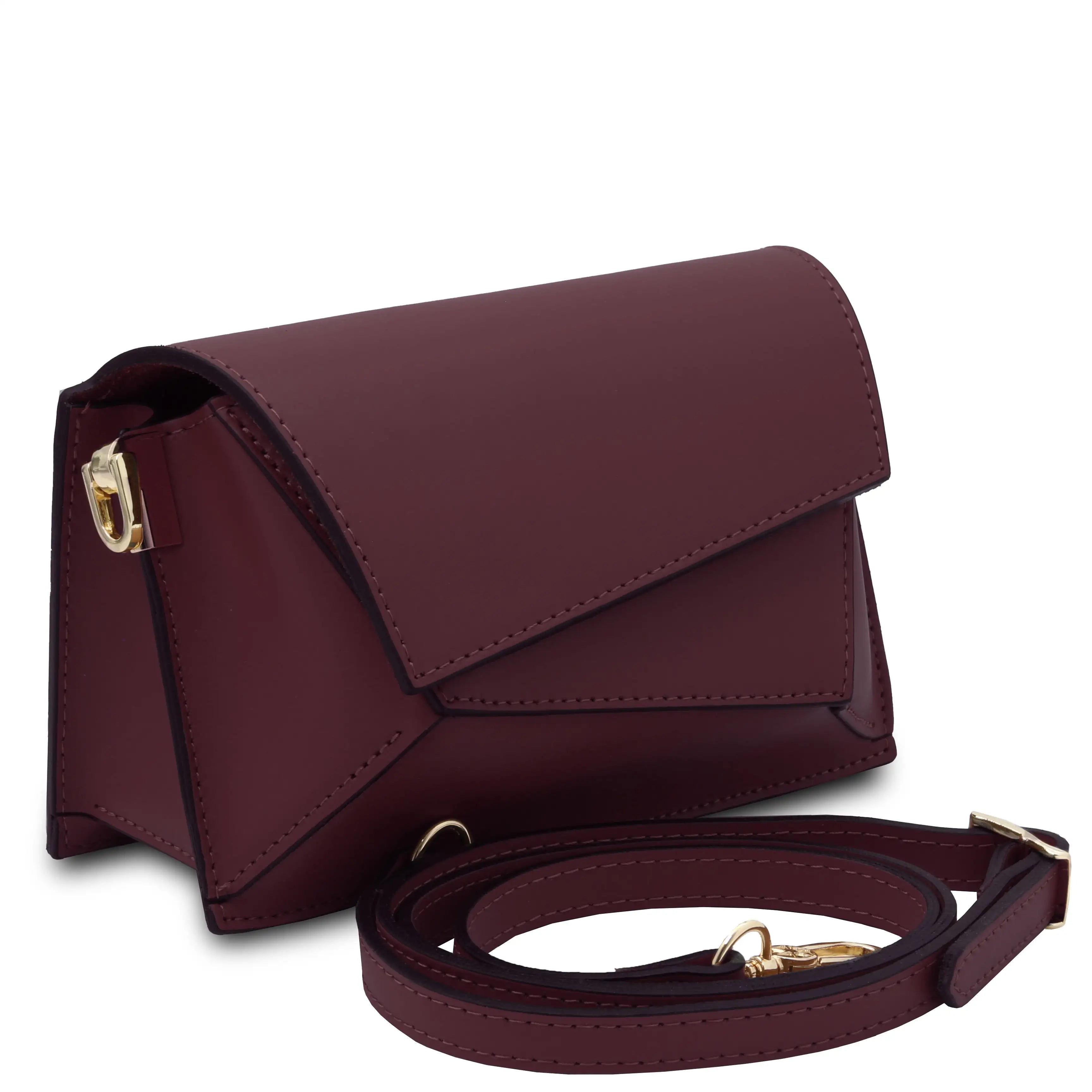 Bordeaux leather crossbody bag with a removeable strap on a white background