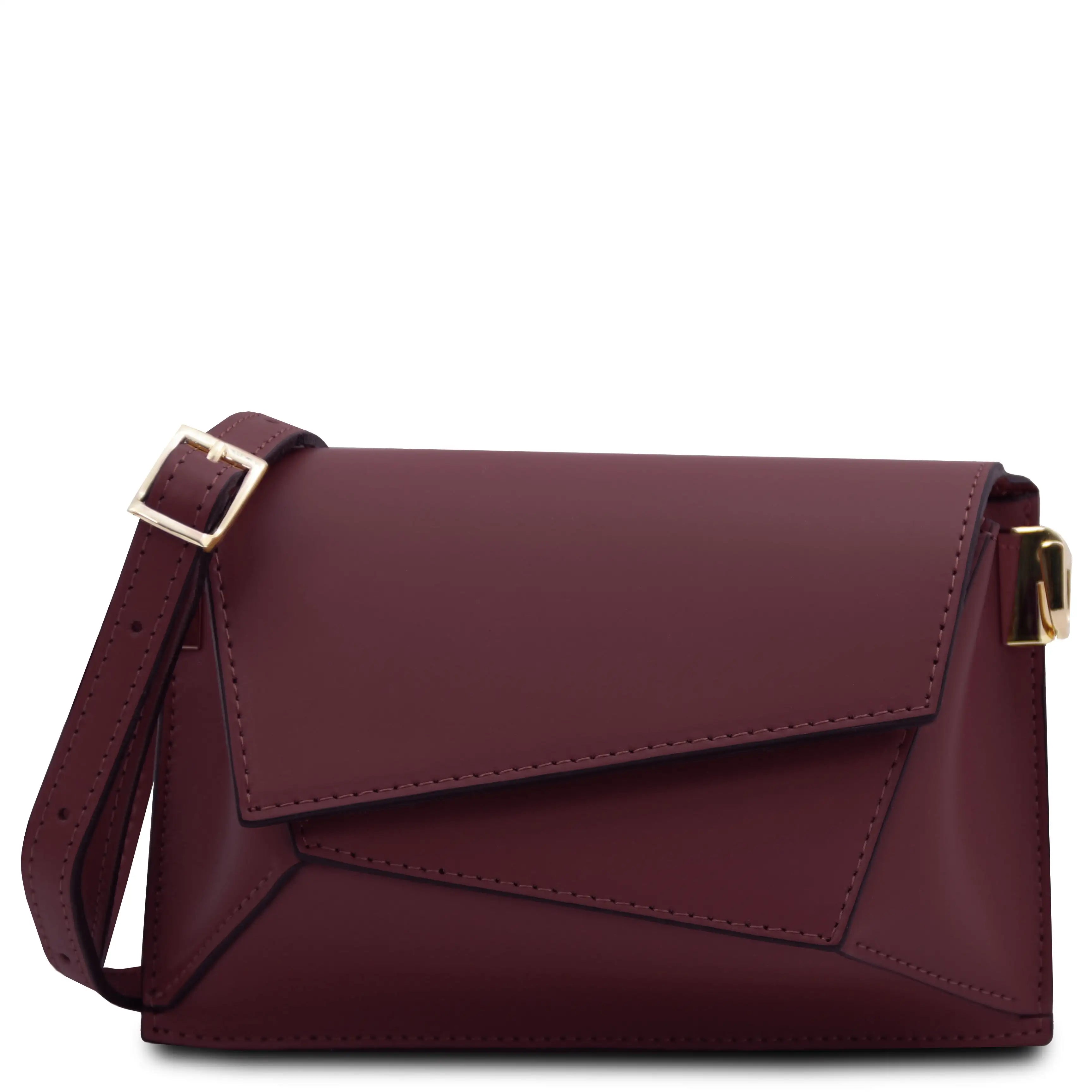 A bordeaux leather crossbody bag with a flap closure, gold-tone buckle strap, and gold-tone side hardware on a plain white background.