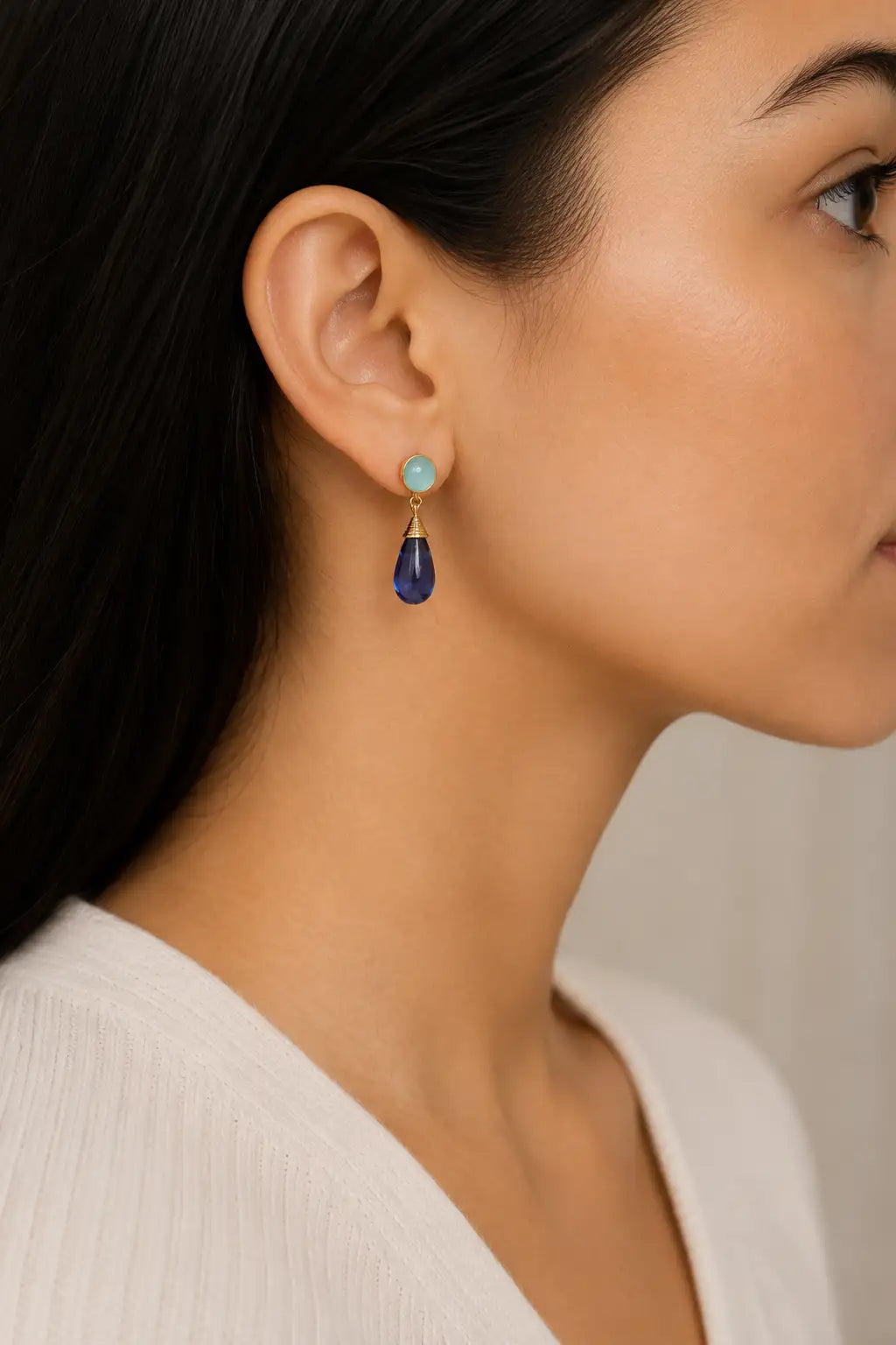 Nevaeh Drop Earrings Aqua Chalcedony & Blue Iolite with 18K gold accents on a woman's right ear.