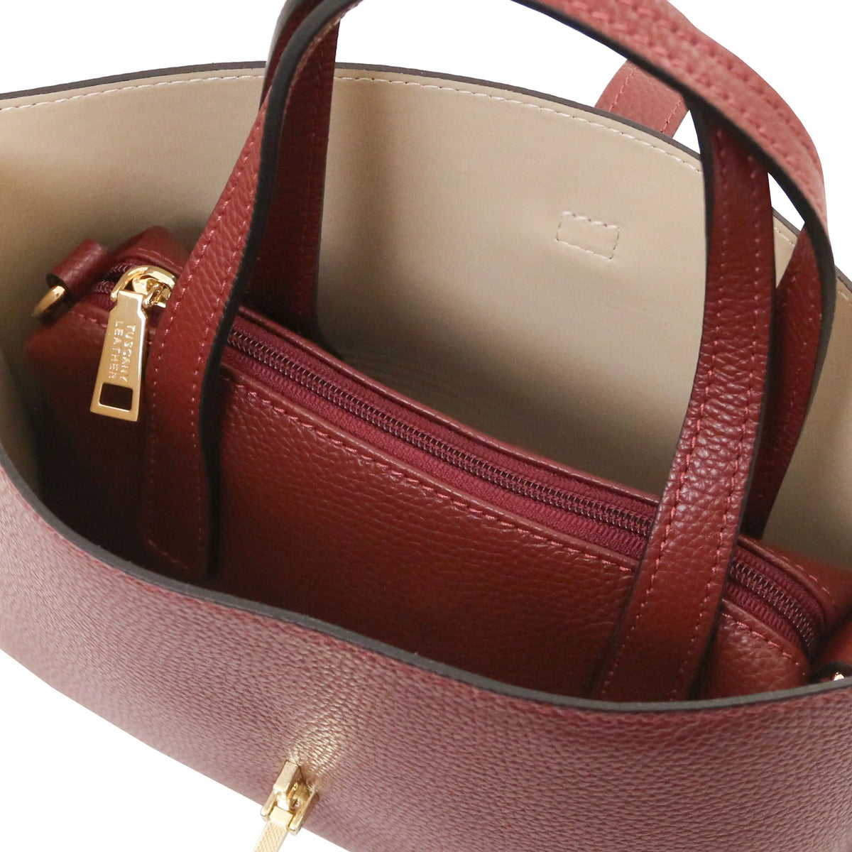Interio beige lining view Agatha Leather Handbag in bordeaux with central zipped compartment