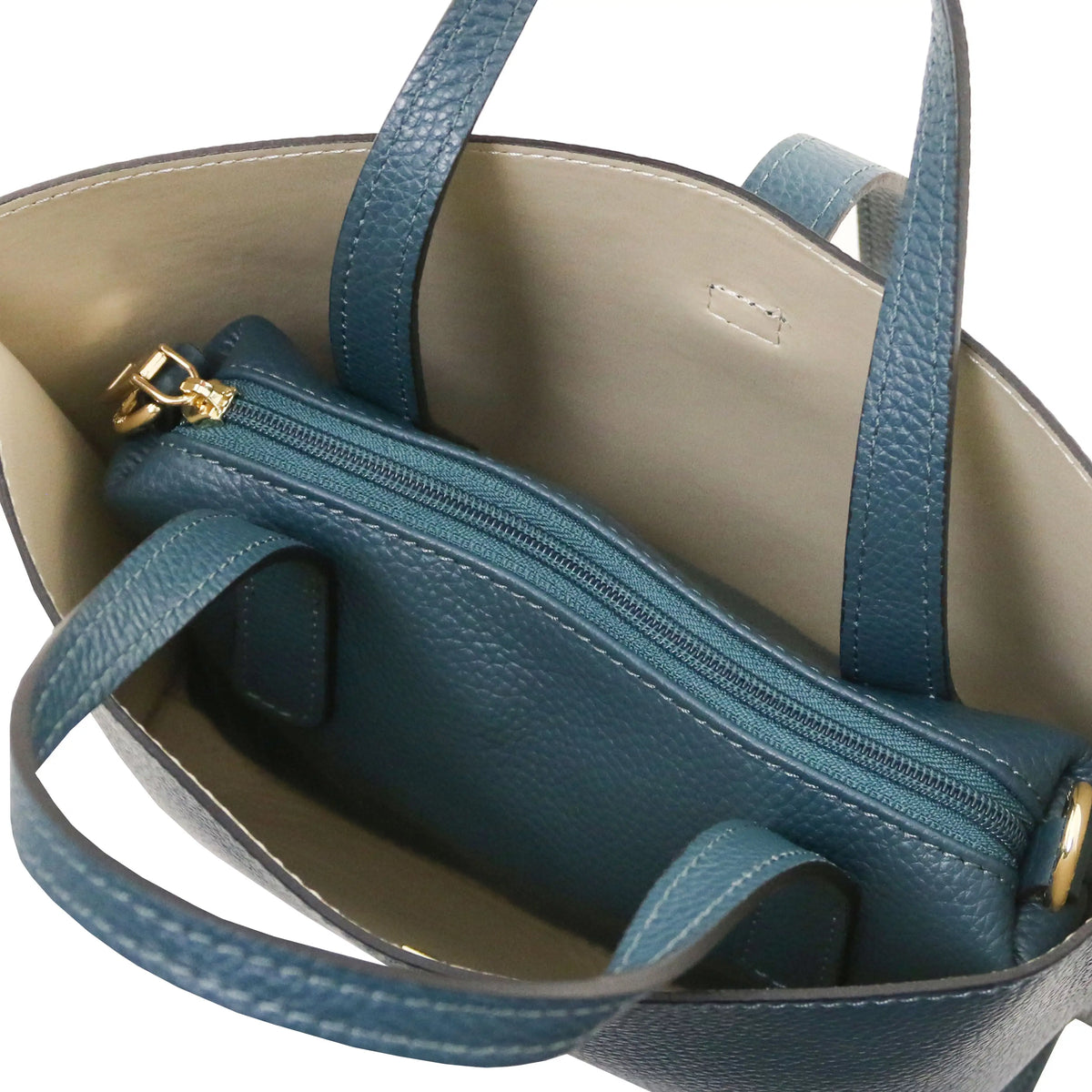 Interio beige lining view Agatha Leather Handbag in teal with central zipped compartment