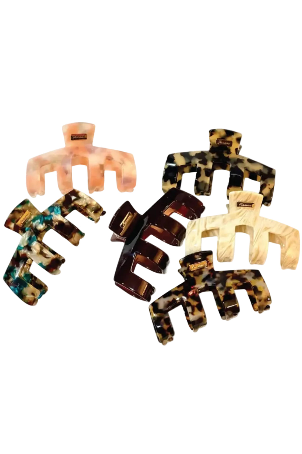 Six hair claw clips in assorted tortoiseshell and marbled patterns, arranged on a plain white background.