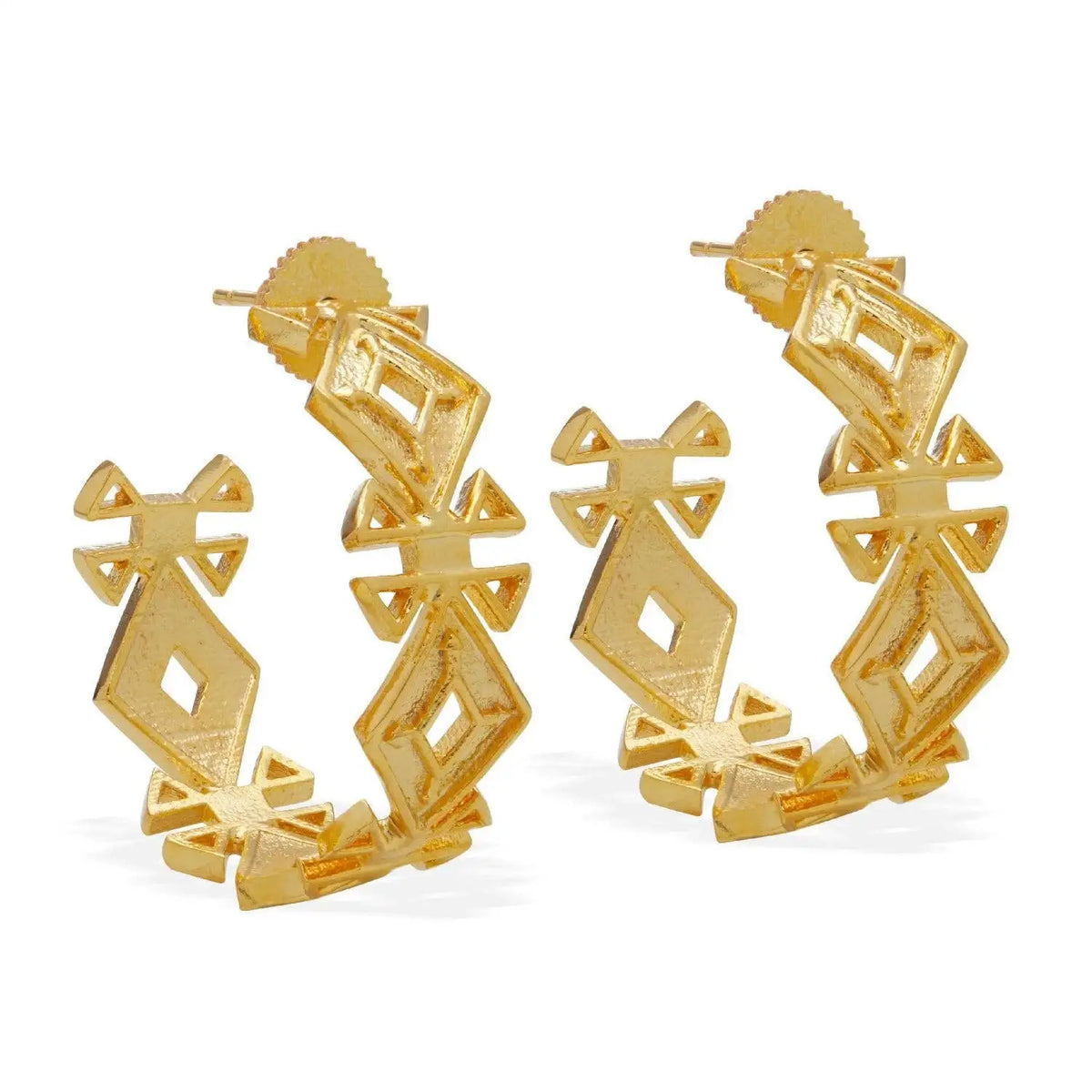 A pair of gold geometric hoop earrings with a textured, openwork diamond and bow-like pattern, shown on a clean white background.