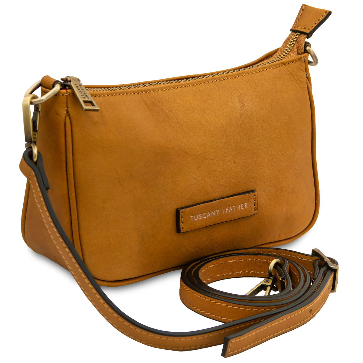 Natural leather handbag with a detachable strap on a white background