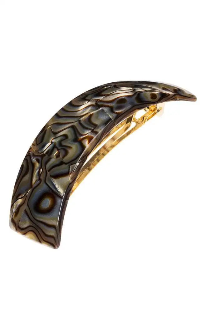 Decorative hair clip with an intricate black swirl pattern on a white background