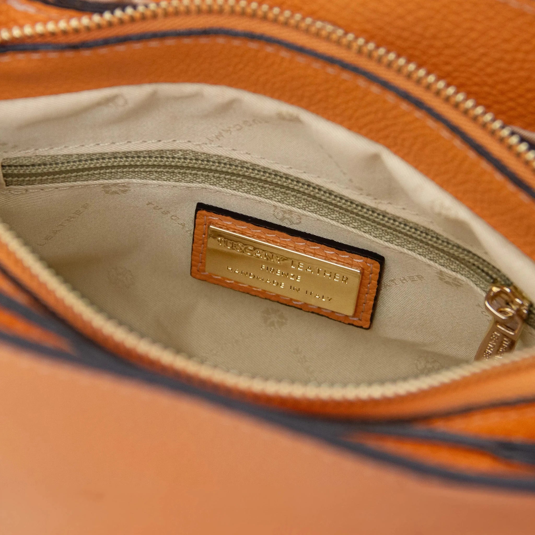Interior zip pocket view Apricot Abby Leather Bag with beige lining