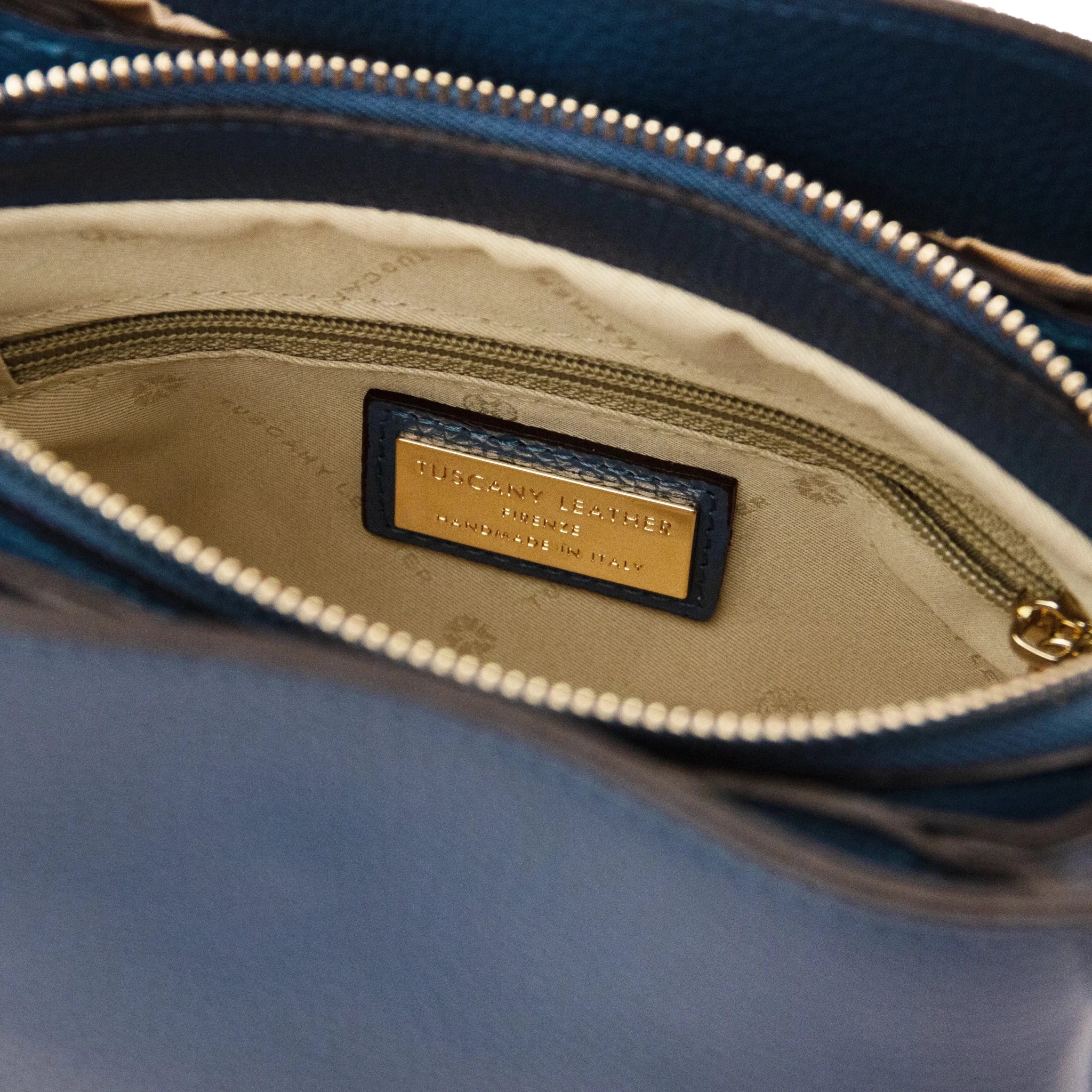 Interior zip pocket view Denim Abby Leather Bag with beige lining
