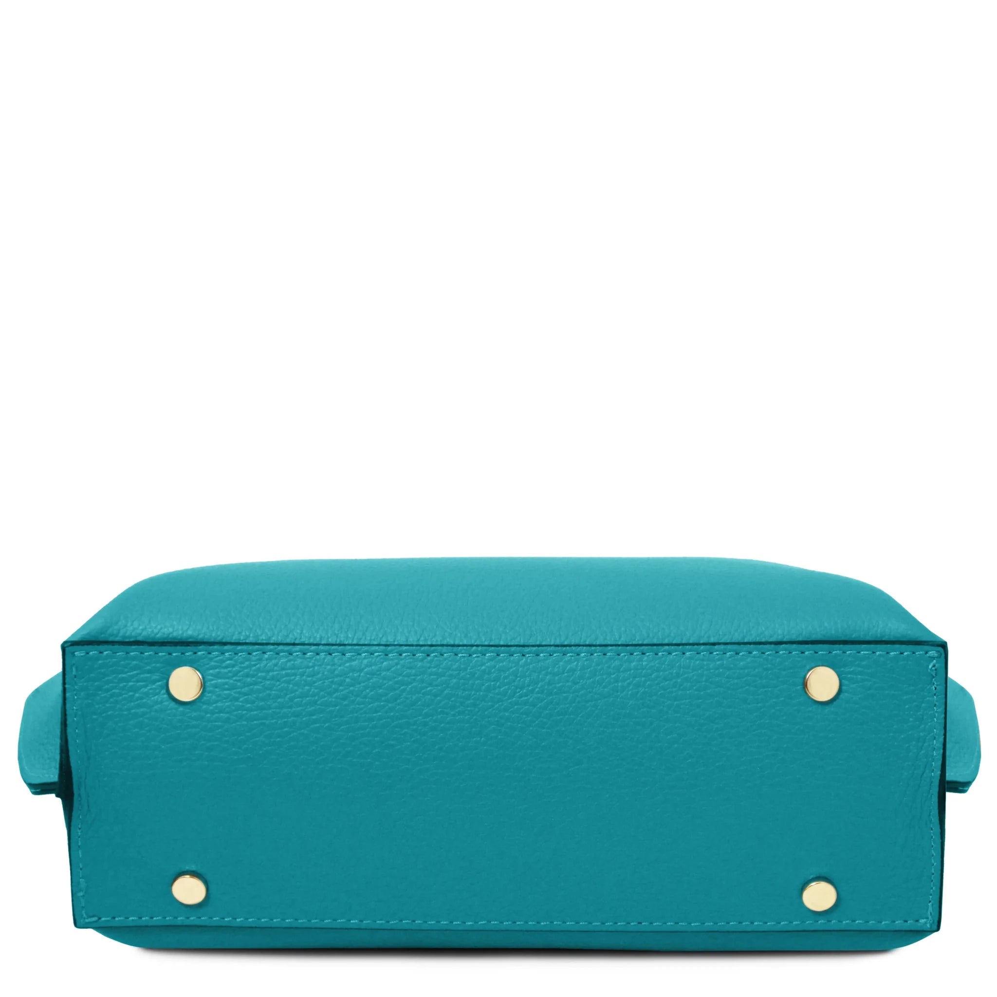 Bottom view of turquoise leather bag with gold protective feet on a white background