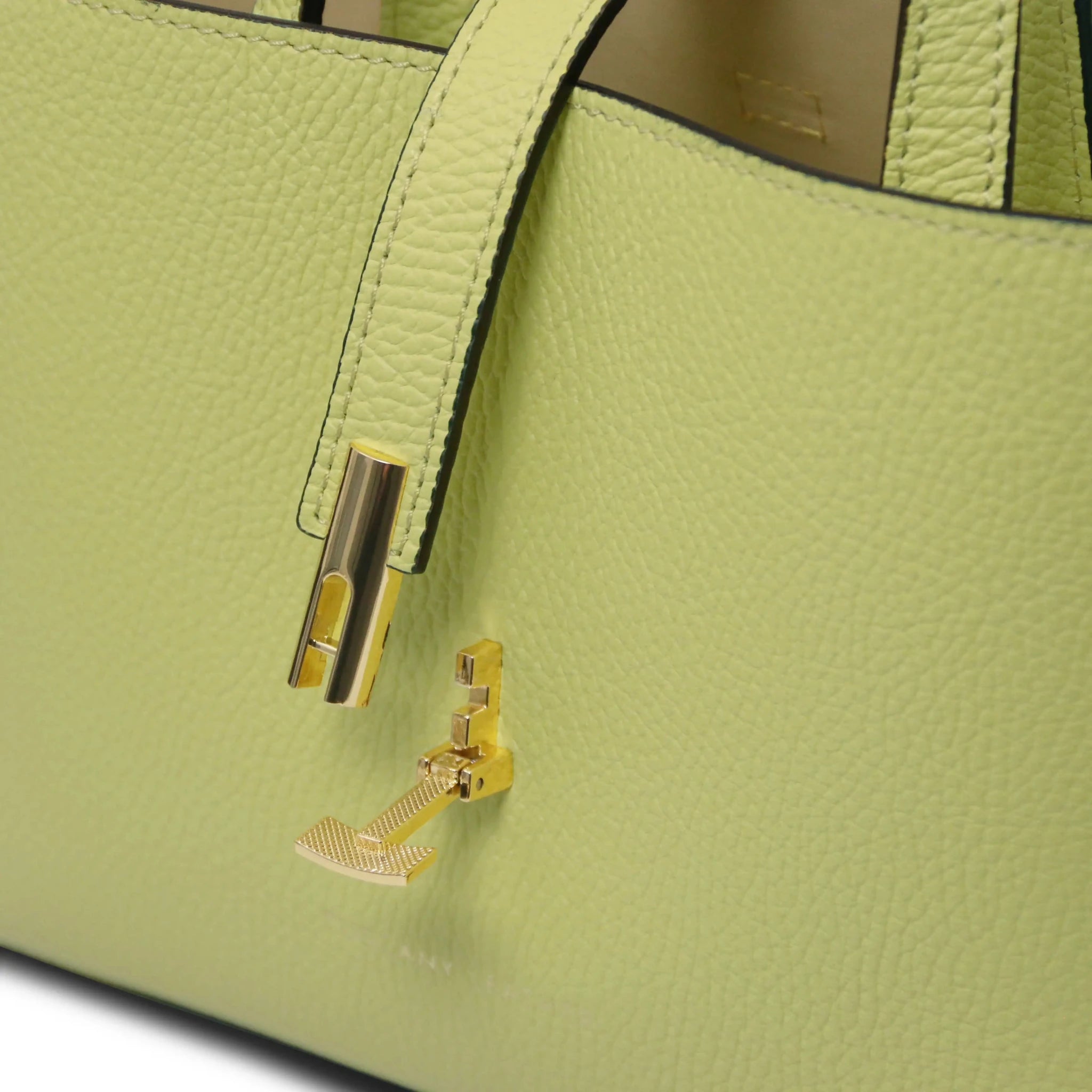 Lime Green leather handbag with gold twist clasp lock and 'Tuscany Leather' branding.