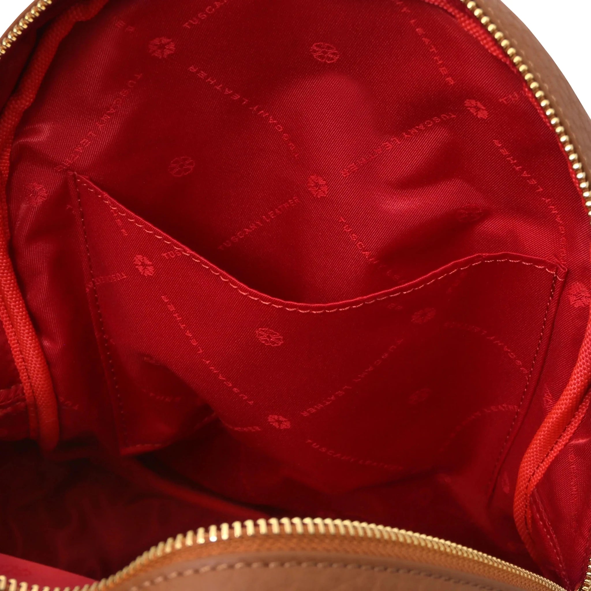 Interior open pocket view Arco Italian Pebbled Leather Backpack in Cognac with red lining