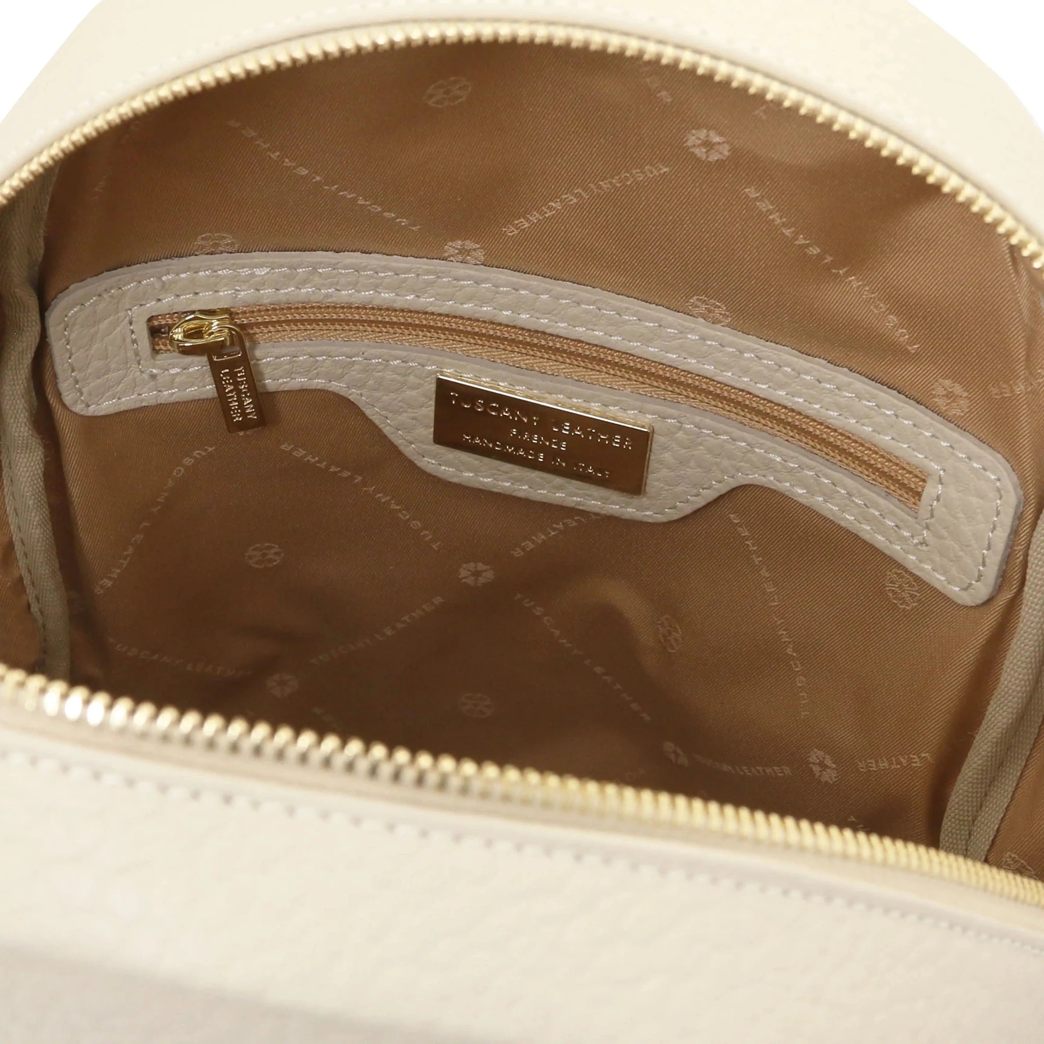 Interior zip pocket view Arco Italian Pebbled Leather Backpack in Beige with tan lining