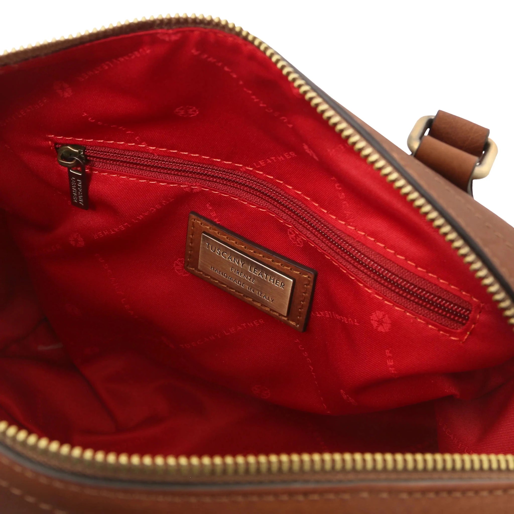 Interior zip pockets view Barrique Leather bag in brown with red linin