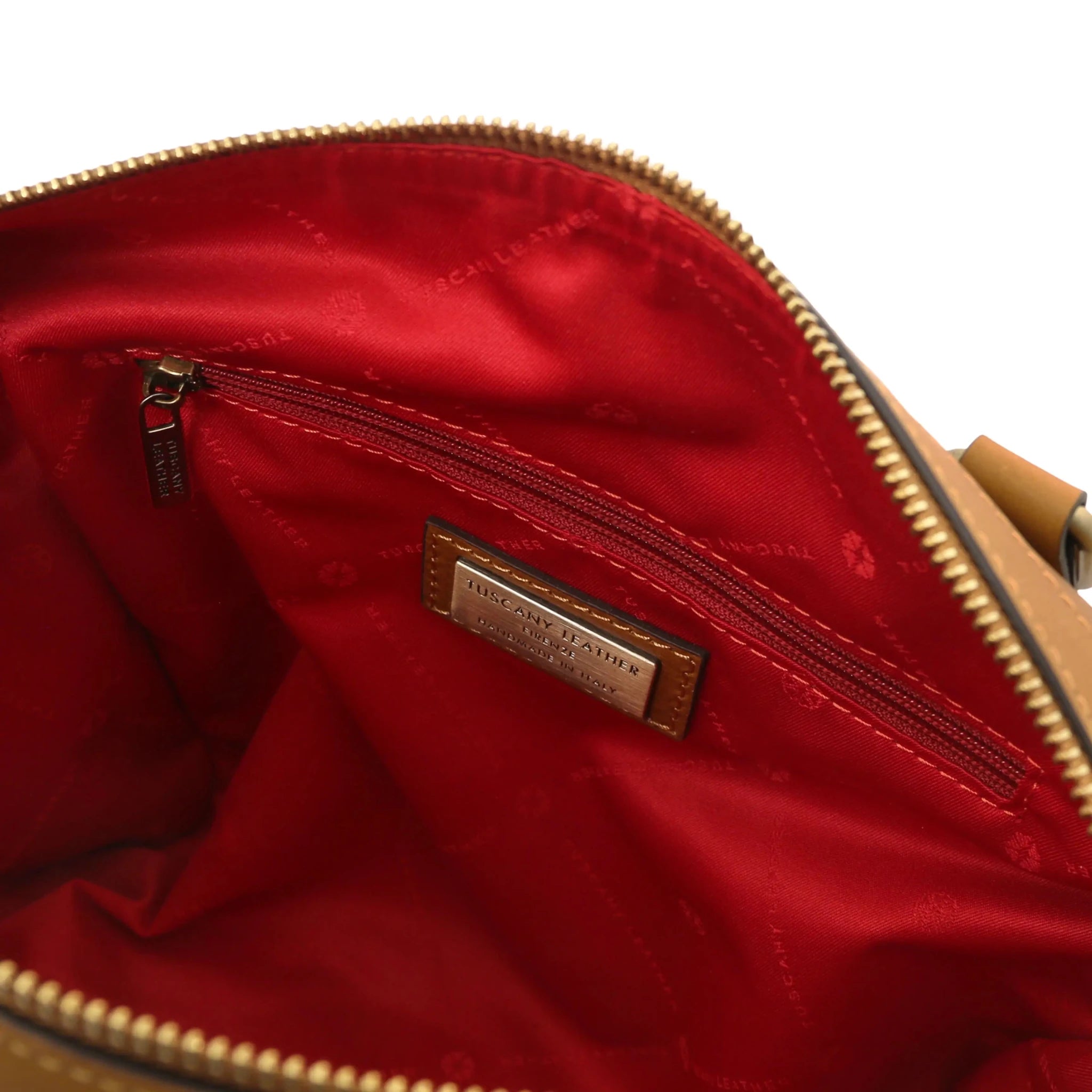Interior zip pockets view Barrique Leather bag in natural with red lining