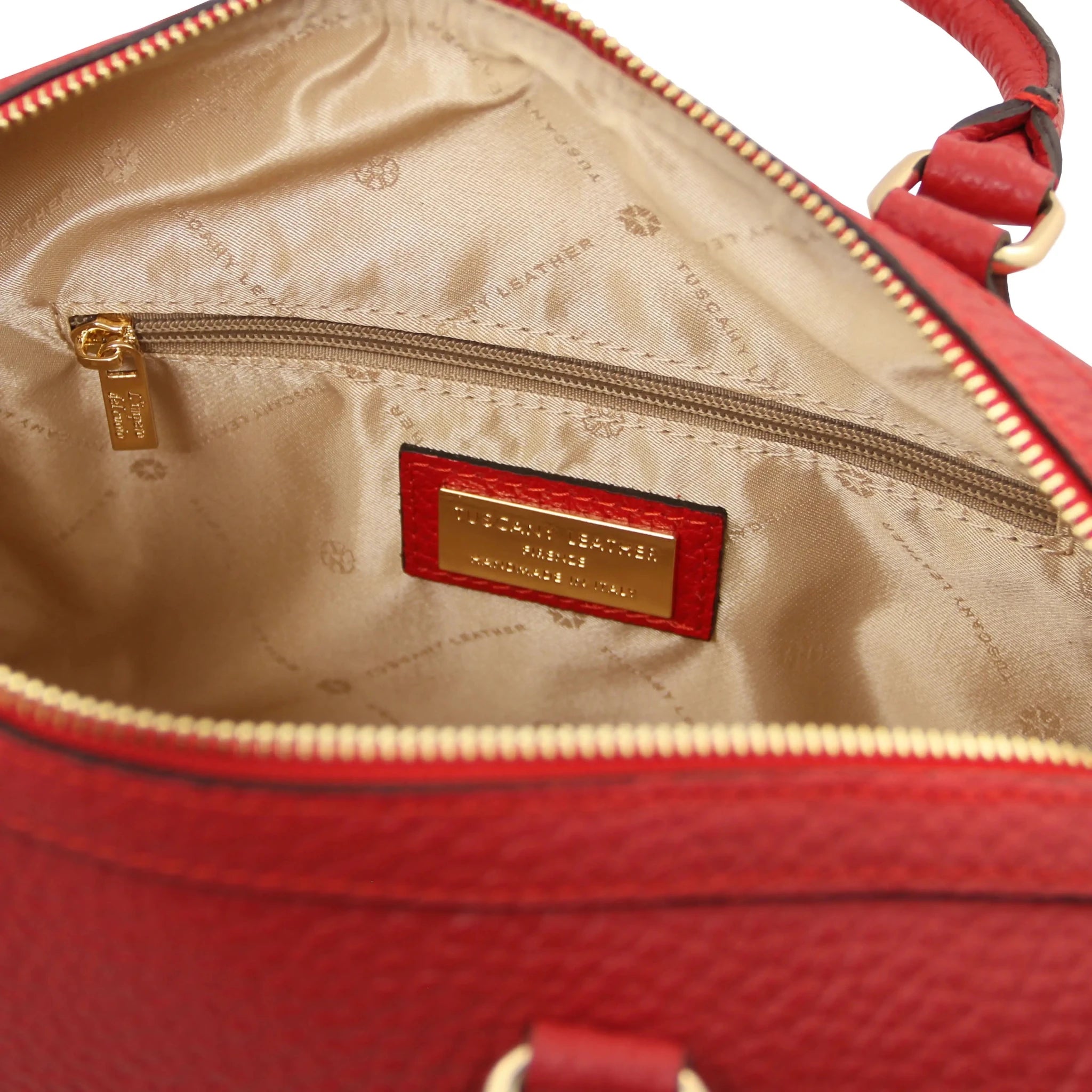 Interior zip pockets view Barrique Leather bag in red with beige lining