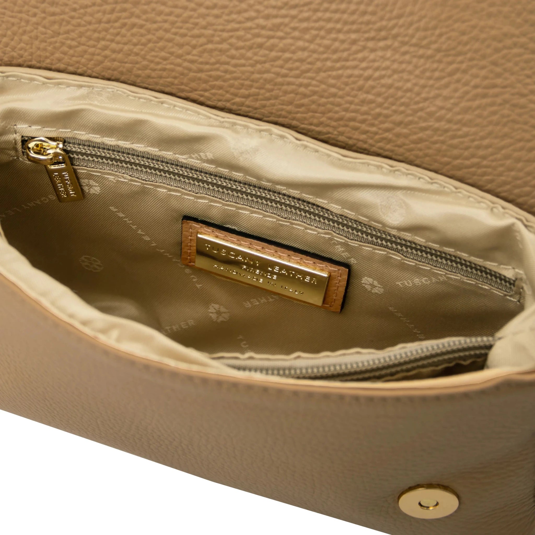 Interior zip and central compartment pockets beige lining view Biscuit Soft Shoulder Bag in Caramel