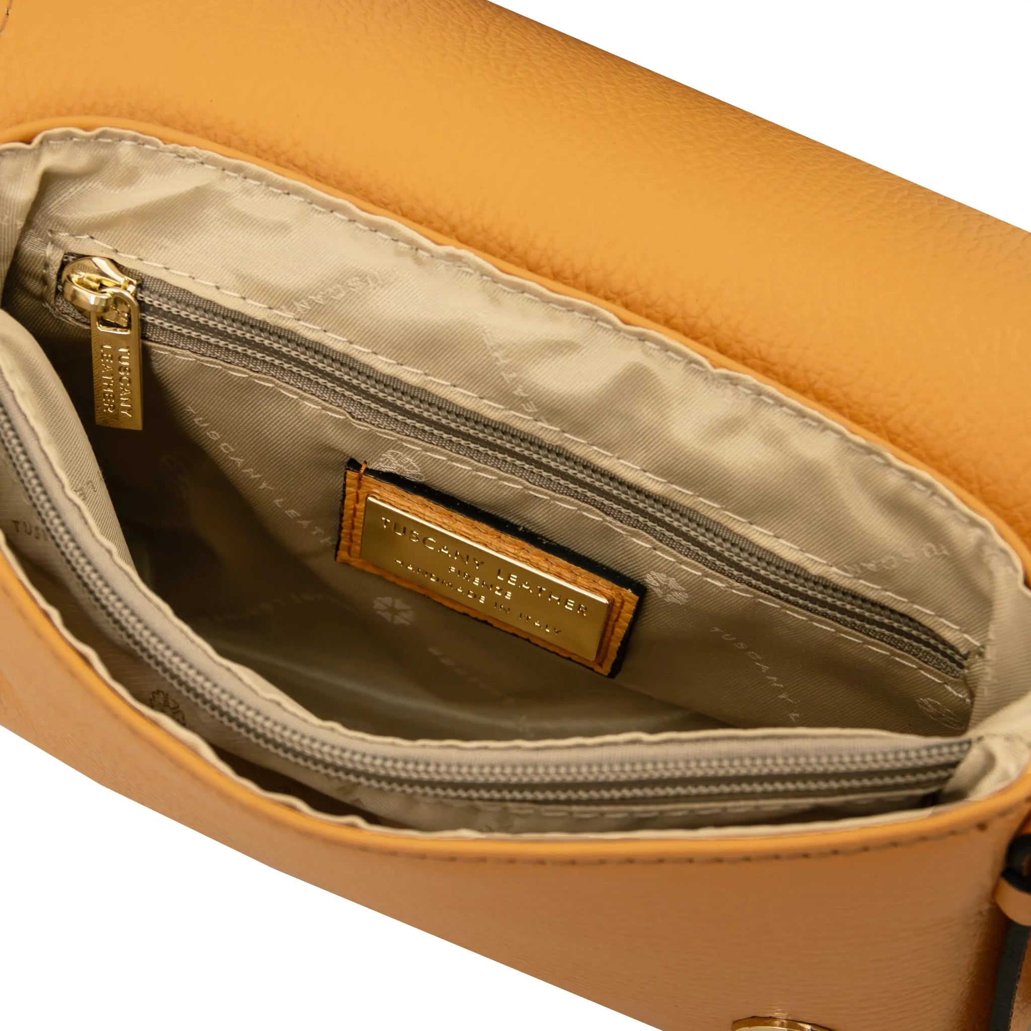 Interior zip and central compartment pockets beige lining view Biscuit Soft Shoulder Bag in apricot 