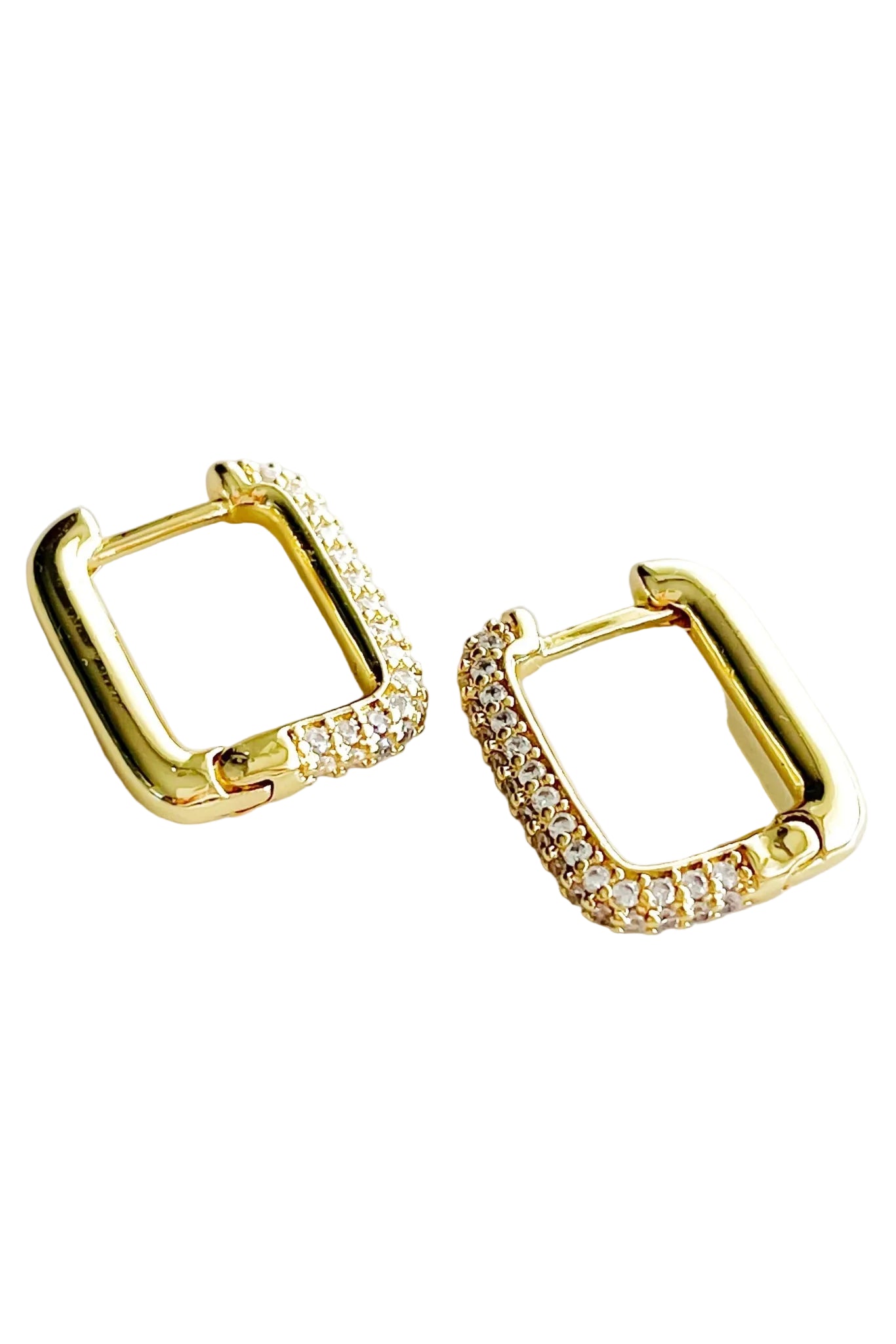 Gold hoop earrings with clear cubic zirconia on a white background