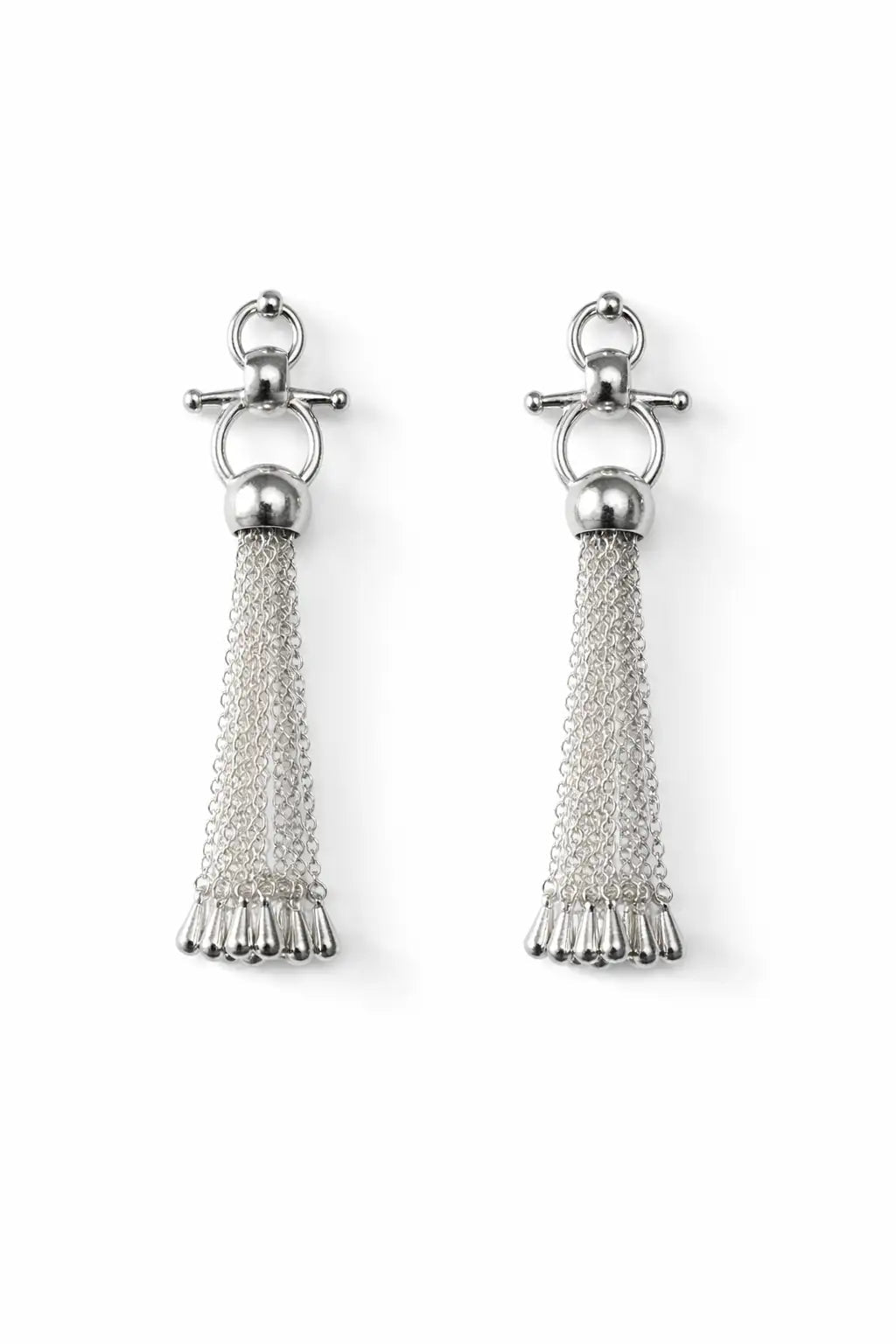 Pair of silver horse bit tassel earrings on a white background