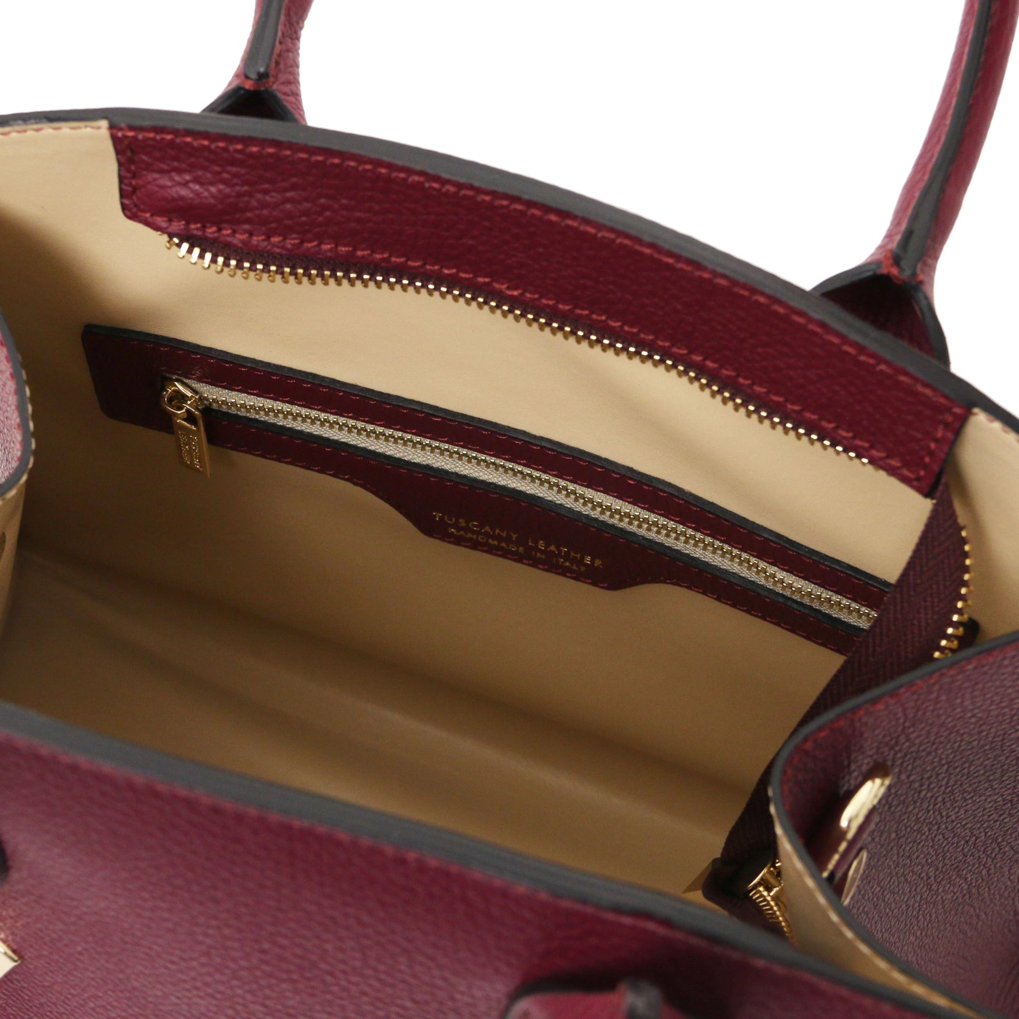 Interior Zip Pocket View Coccola Italian Pebbled Leather Handbag in bordeaux with beige lining