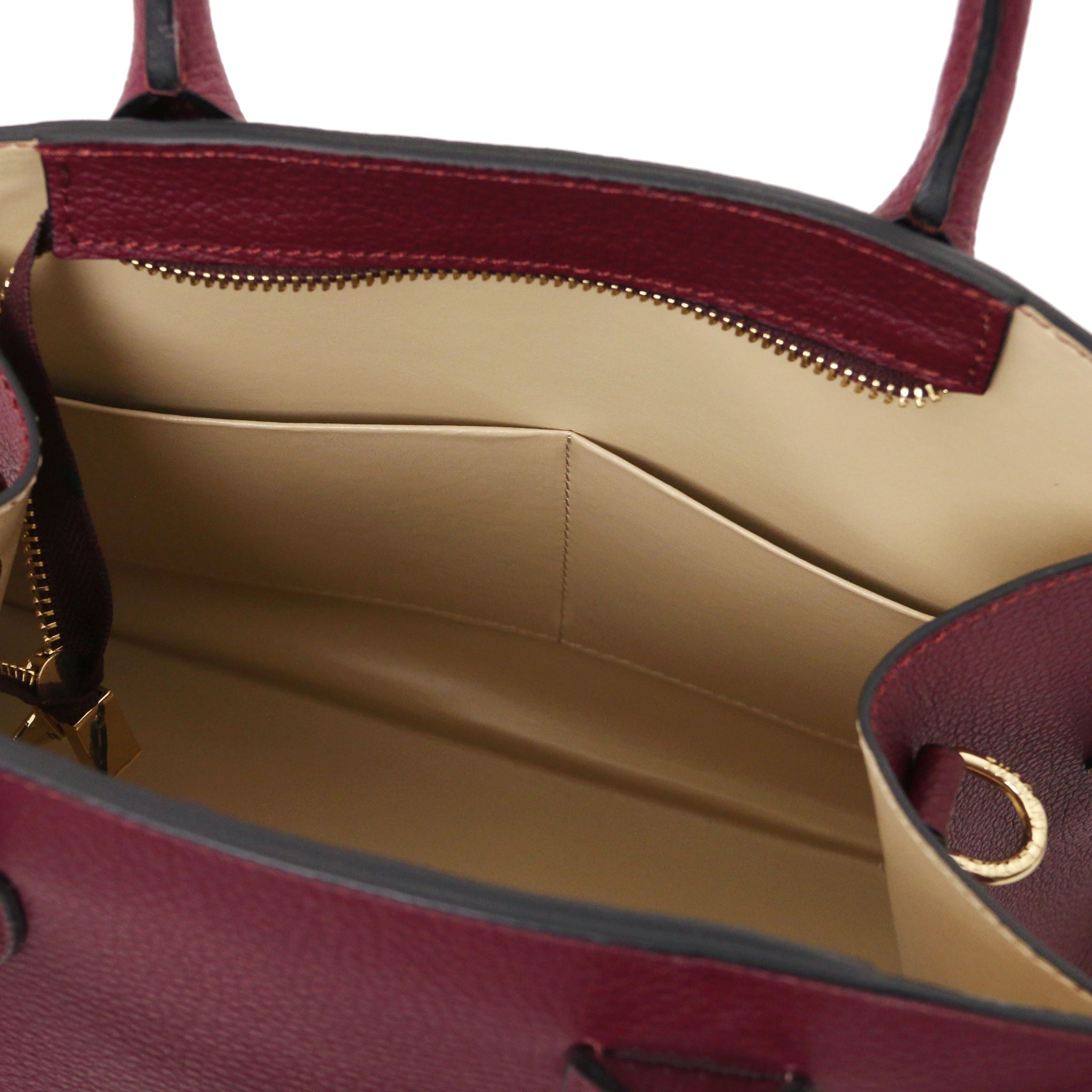 Interior Open Pocket View Coccola Italian Pebbled Leather Handbag in bordeaux with beige lining