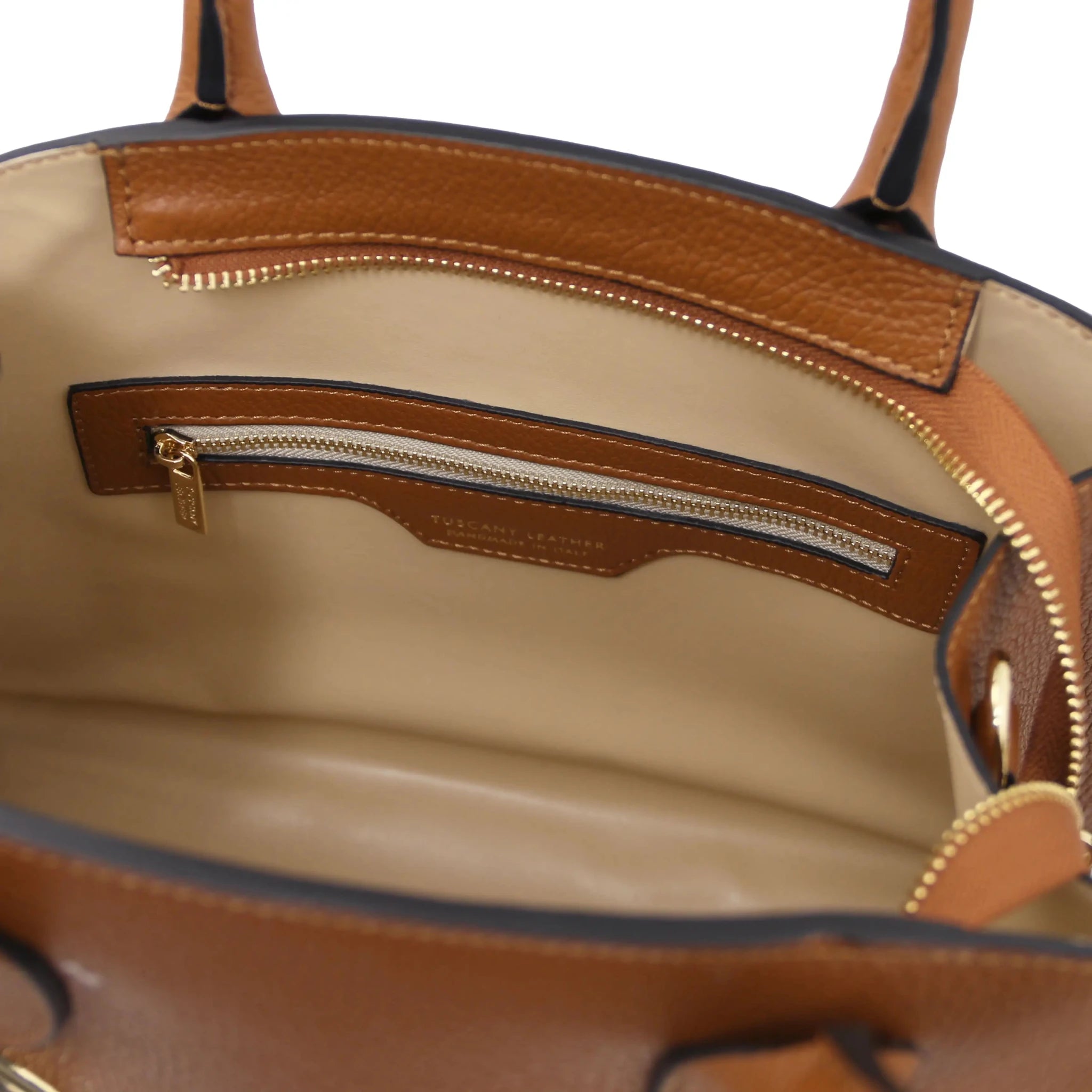 Interior Zip Pocket View Coccola Italian Pebbled Leather Handbag in Cognac with beige lining