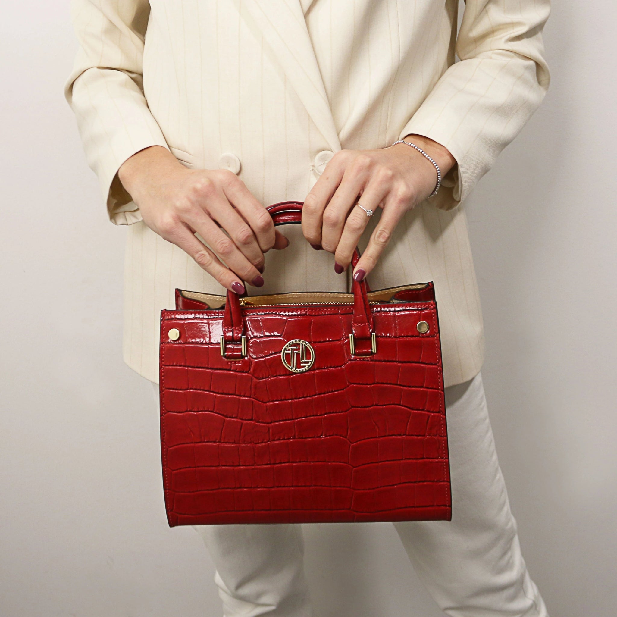 Woman holding the Red Croque Croc Print Italian Leather Handbag