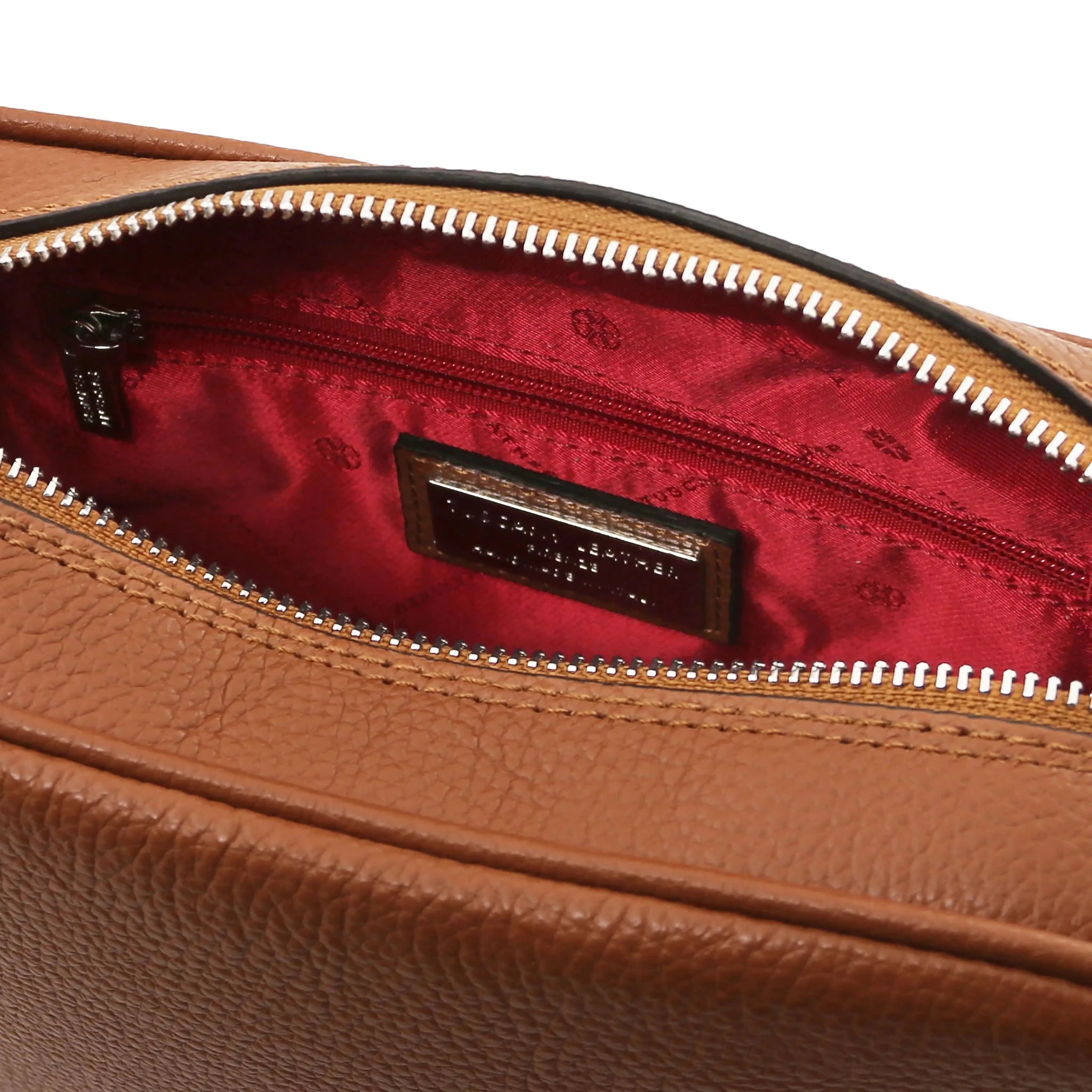 Interior zip pocket view cognac Cubetto Leather Shoulder Bag with red interior