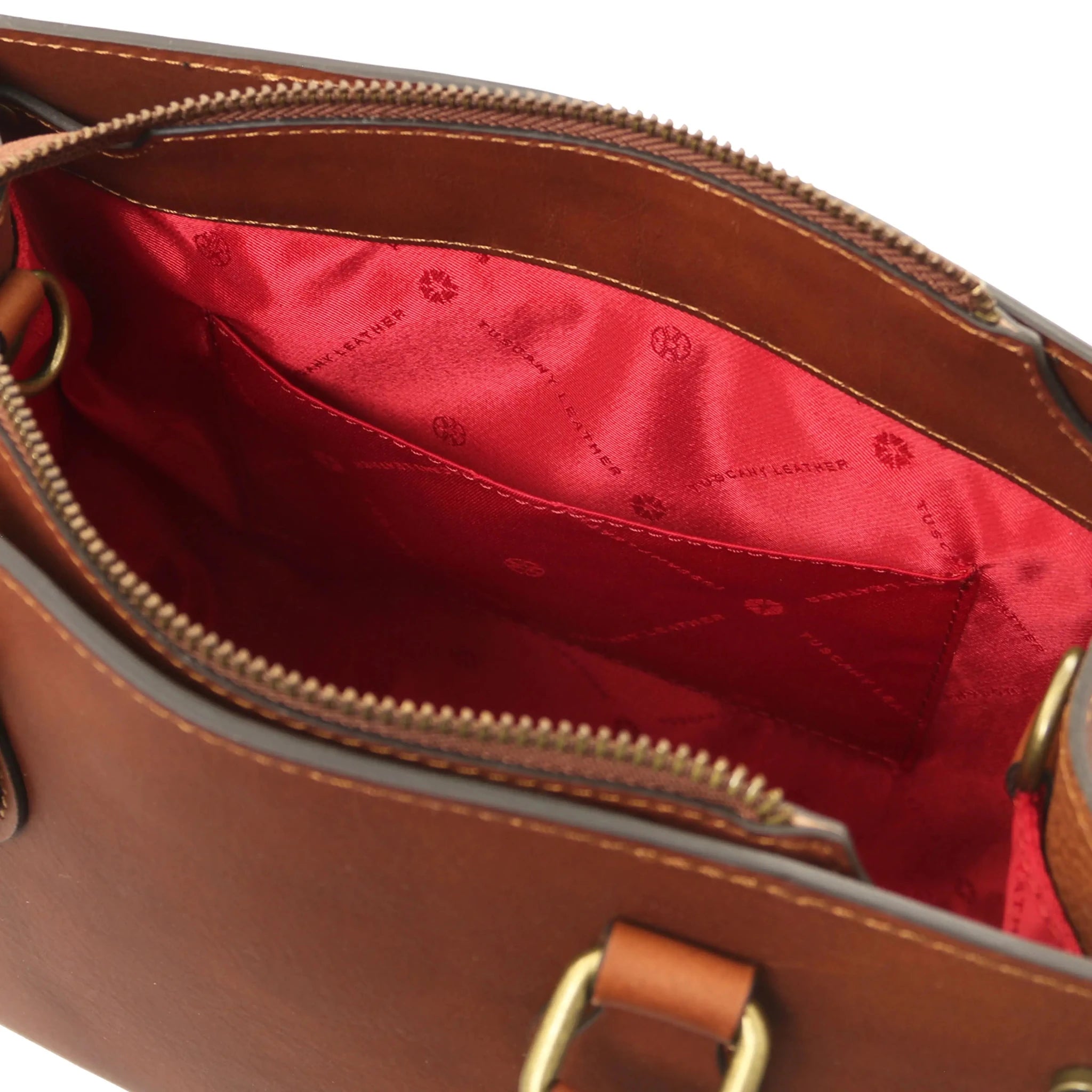 Interior open pocket red lining view Dama Leather Handbag in brown