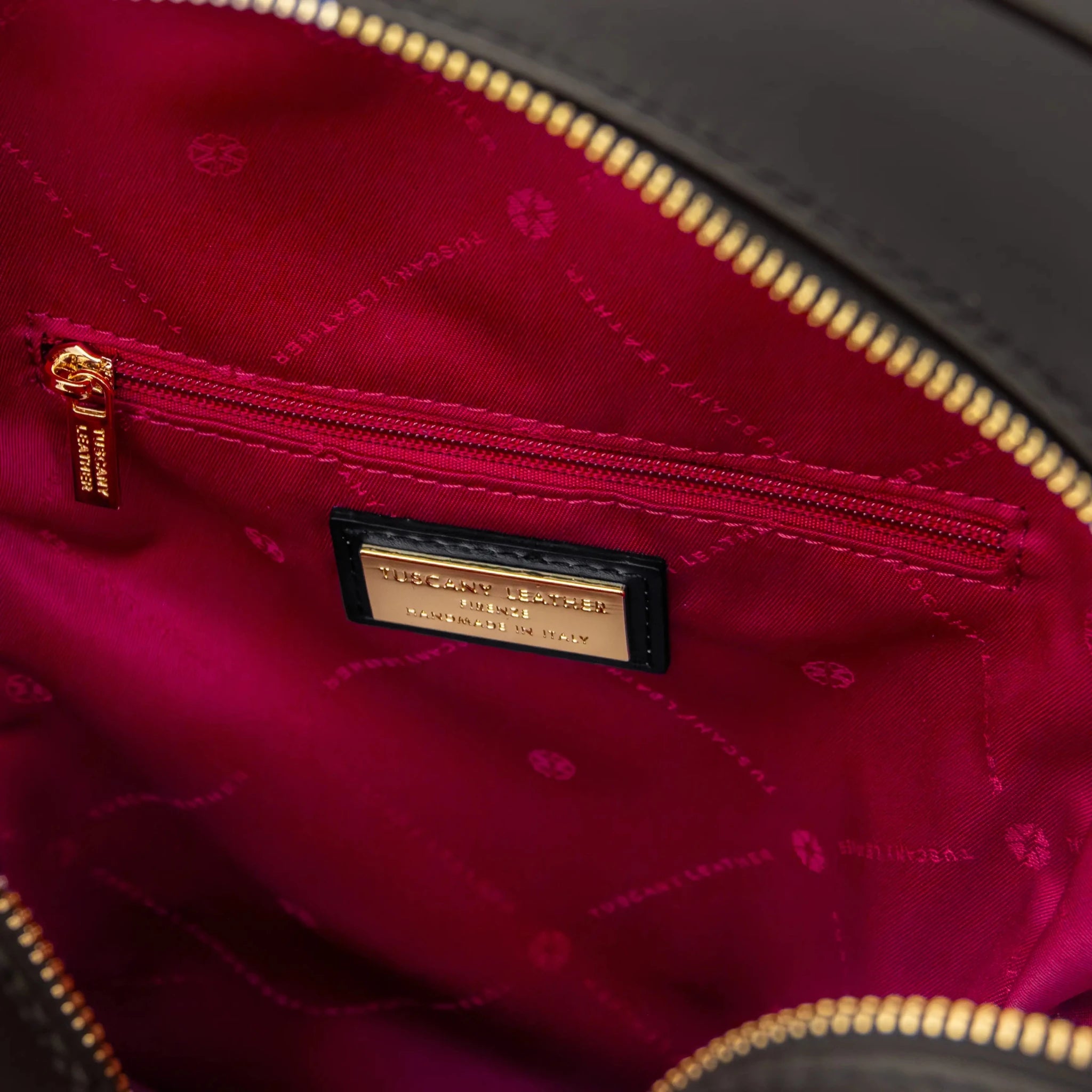 Interior zip pocket view Dedalo Woven  Leather Backpack in black with red lining