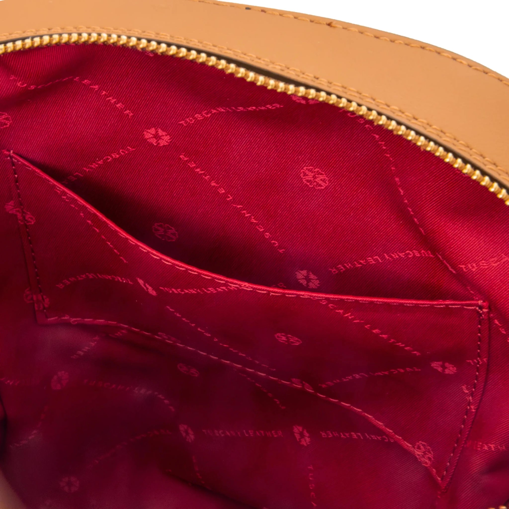 Interior open pocket view Dedalo Leather Backpack in cognac with red lining