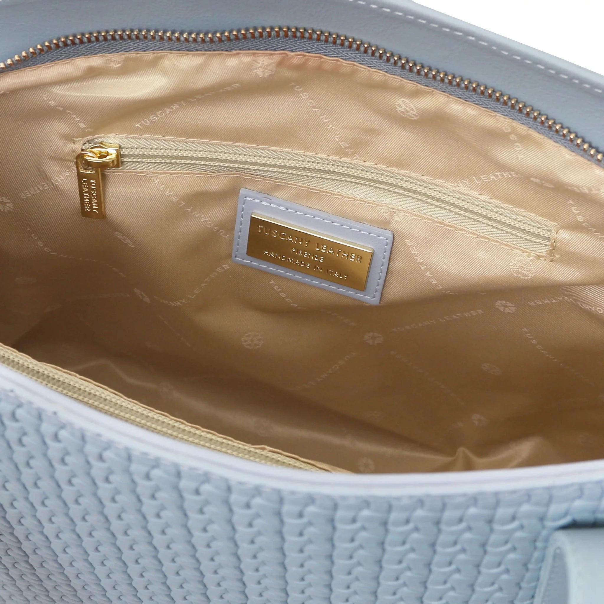 Interior zip pocket view Dedalo Woven  Leather Shopping Bag in light blue with beige lining