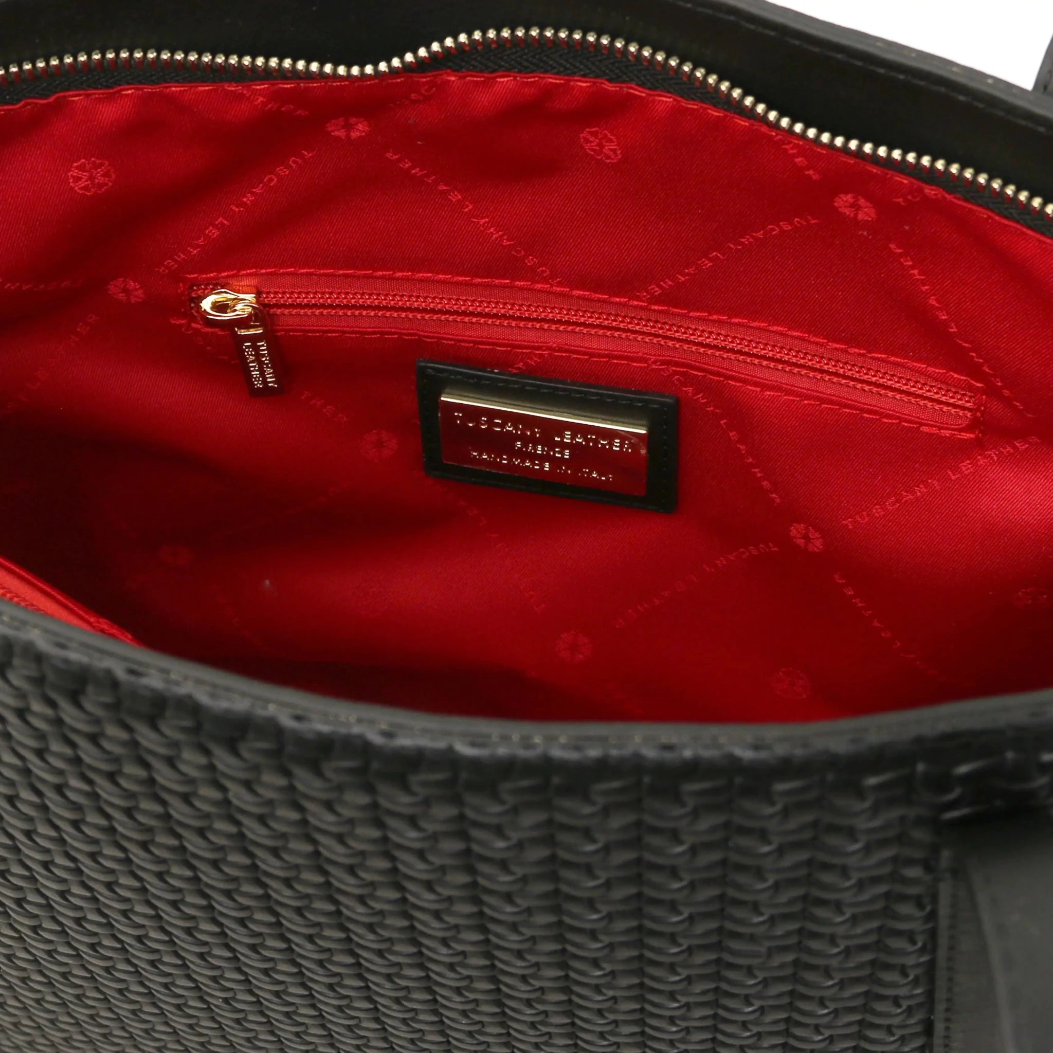 Interior zip pocket view Dedalo Woven  Leather Shopping Bag in black with red lining