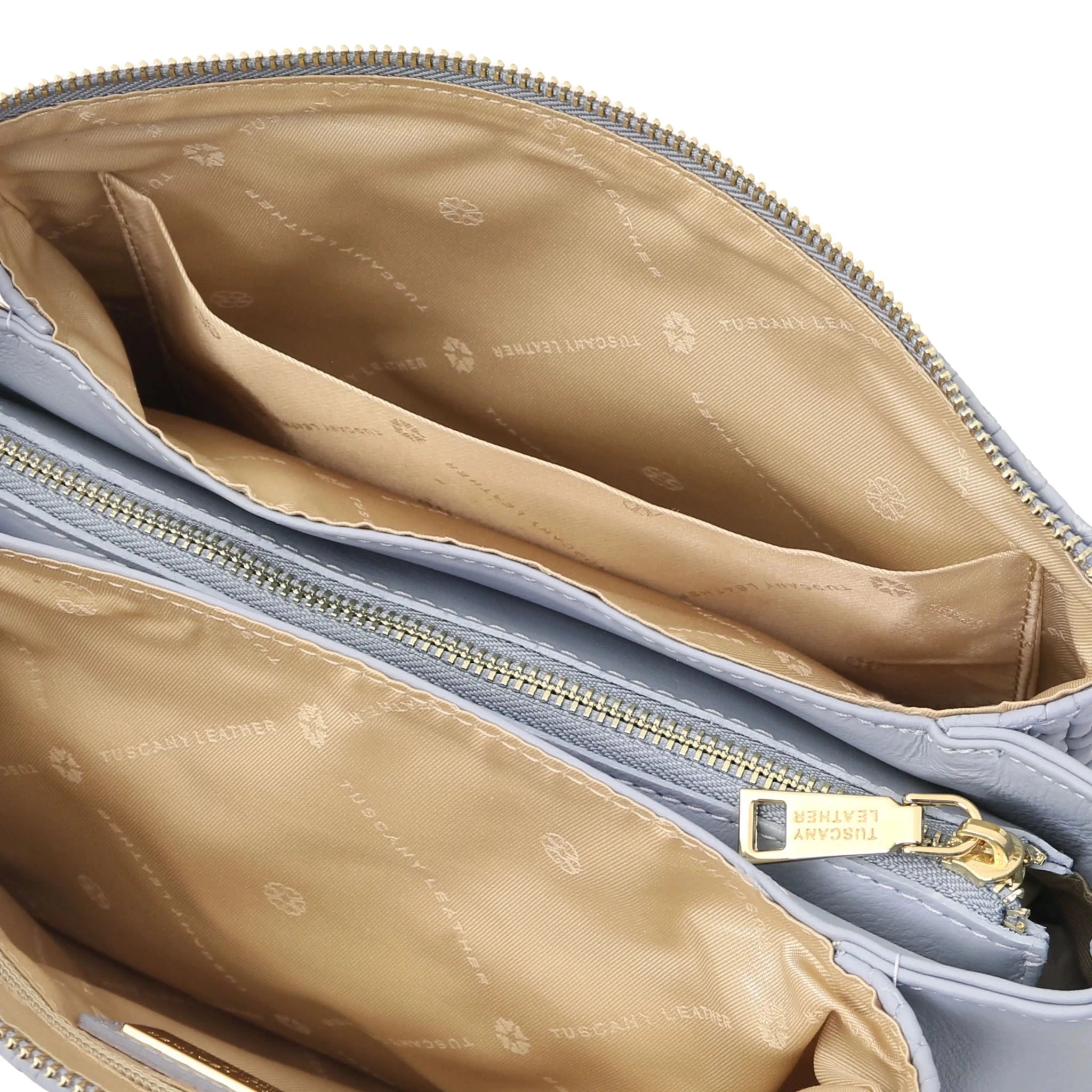 Interior open pocket beige  lining view Dedalo Shoulder Bag in Light Blue